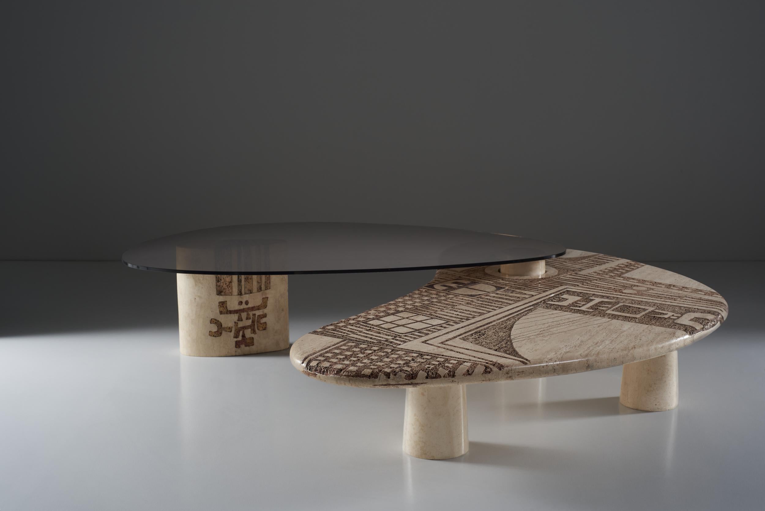 The table designed by Nerone Patuzzi is a deeply malleable table despite the apparent rigidity of marble. The possibility to compose and adapt the table to one's own needs, implies a perimeter area within which it can rotate. The engraved marble,
