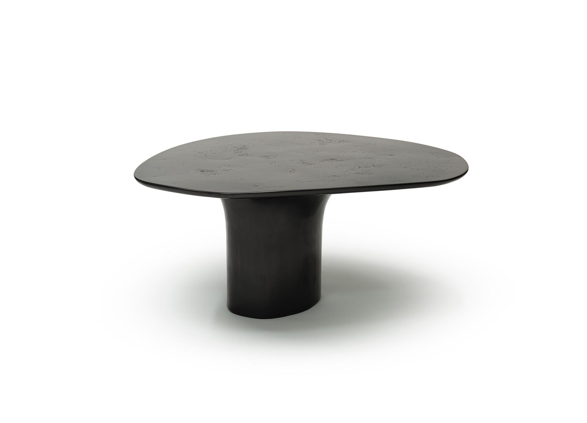 NR black smooth Pinin, 21st century contemporary sculptured circular black low table

The highly edge intuitively shaped low table possess the touch of lack of gravity. The table top and base constitution convey the impression being a