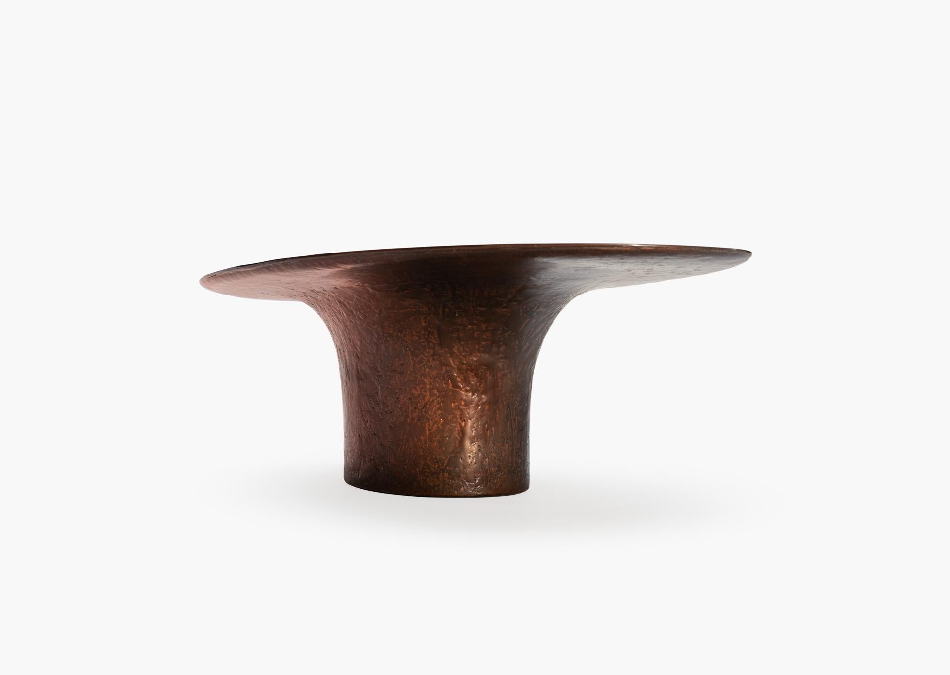 The latest version of the NR low table model, this piece is made of hand sculpted liquid copper resin.
A slightly different size and organic form than the other NR liquid metal tables, this piece adds a new dimension to the collection.