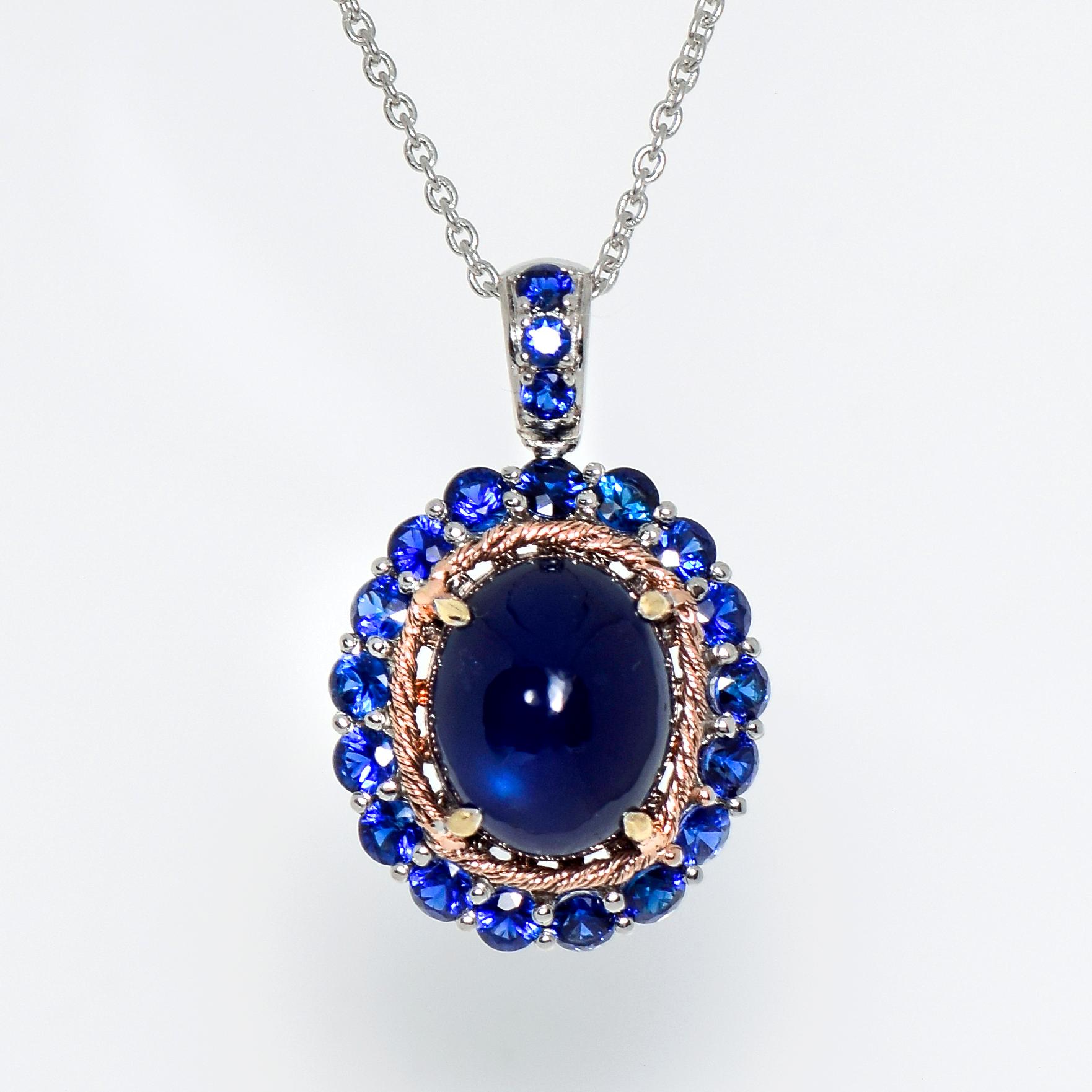 *14k 5.80 Ct Blue Sapphire Antique Art Deco Drop Pendant Necklace*
One natural cabochon deep blue sapphire weighing 5.80 ct sets on the 14K white gold pave' band with natural royal blue sapphires weighing 1.37 ct.    

The necklace is modern and