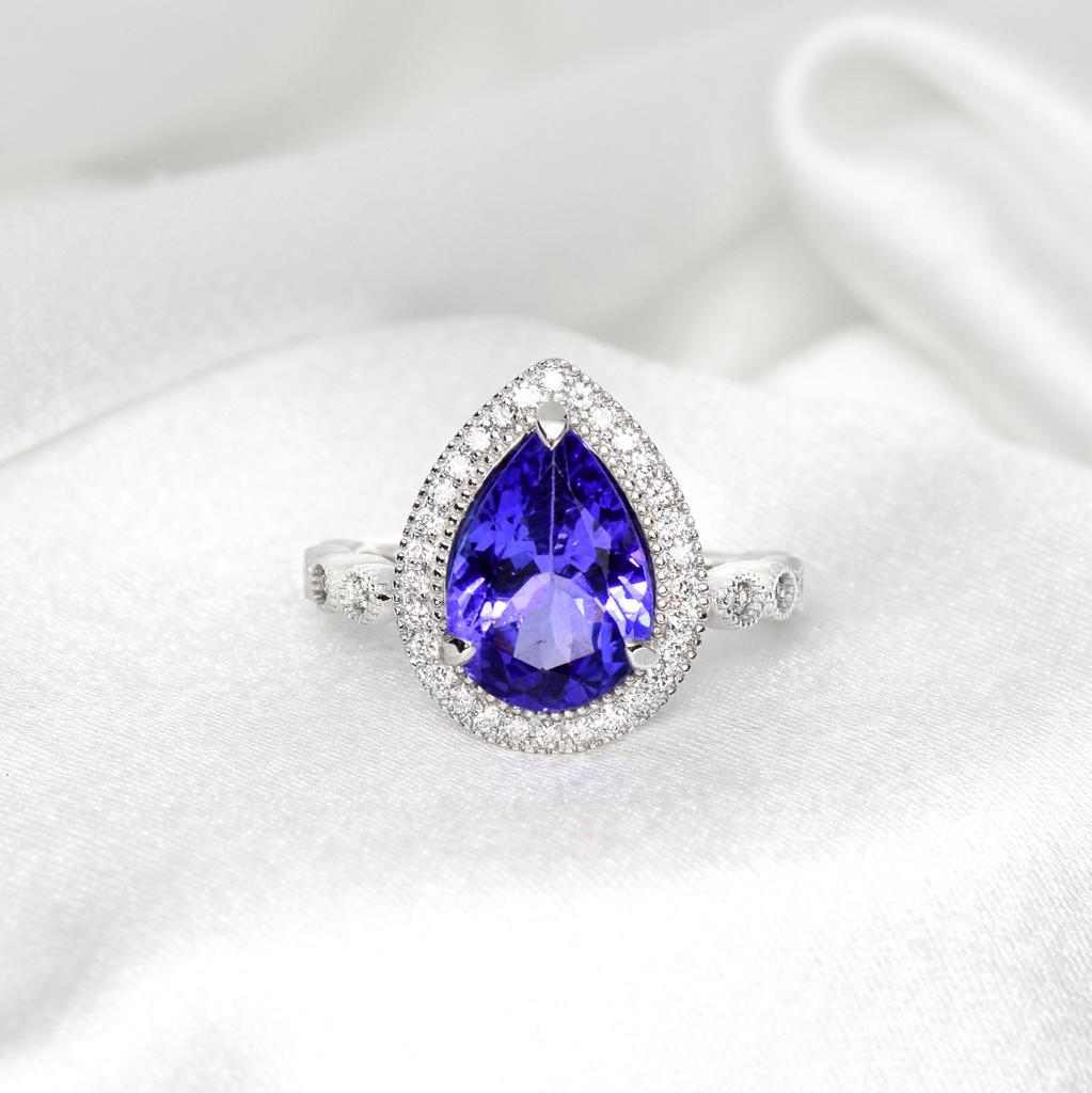 **One IGI 14K White Gold 2.74 Ct Tanzanite&Diamonds Engagement Ring**

One IGI-Certified natural deep violetish Tanzanite as the center stone weighing 2.74 ct surrounded by the FG VS accent diamonds weighing 0.30 ct on the 14K white gold pave'
