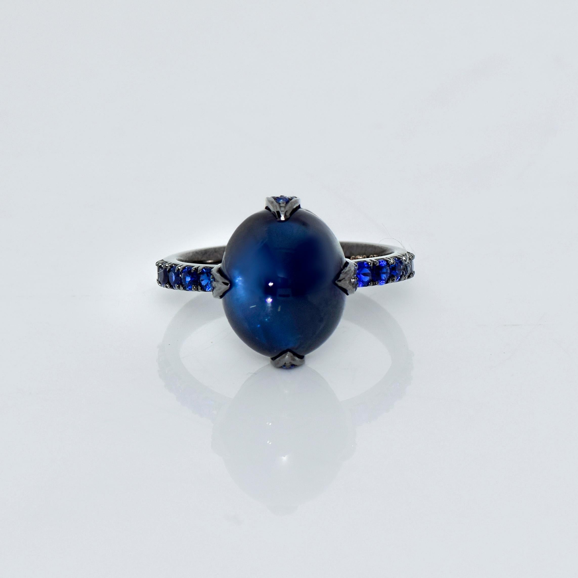 *IGI 14k 7.25 Ct Blue Sapphire Antique Art Deco Engagement Ring*
An IGI-Certified natural cabochon deep blue sapphire weighing 7.25 ct sets on the 14K black gold mixed pave' band with natural royal blue sapphires weighing 0.59 ct.

The 4 prongs
