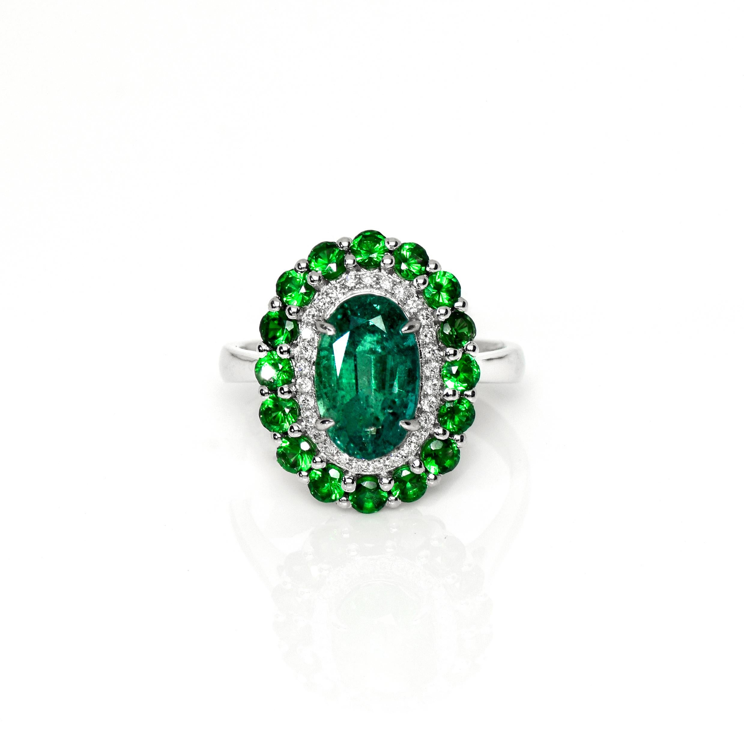 **IGI 18K White Gold 2.21 ct Emerald&Tsavorites Antique Art Deco Style Engagement Ring** 

This ring features a 2.21 ct natural Emerald with an intense luster that is IGI-certified and set on an 18K white gold band with a double halos design. The