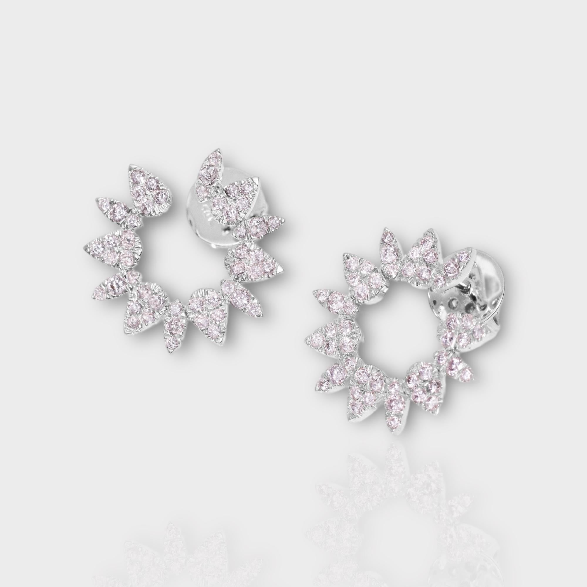 *IGI 14K 0.84 ct Natural Pink Diamonds Radiant Design Stud Earrings*

This band features a stunning design with a radiant crafted from 14K white gold. It is set with natural pink diamonds weighing 0.84 carats.

These earrings feature colorful