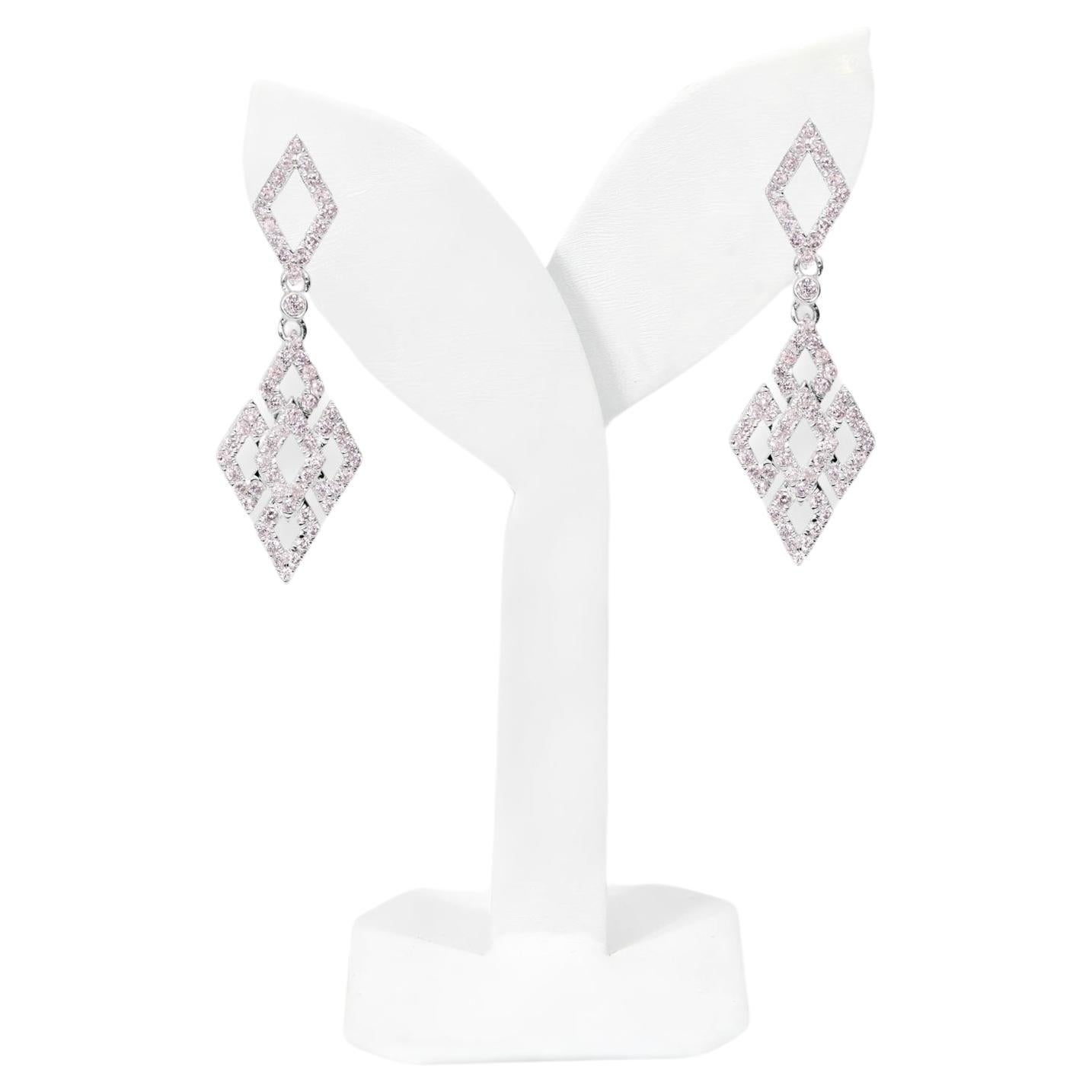*IGI 14K 0.96 ct Natural Pink Diamonds Art Deco Design Stud Earrings*

This band features a stunning art deco design crafted from 14K white gold. It is set with natural pink diamonds weighing 0.96 carats.

These earrings feature colorful natural