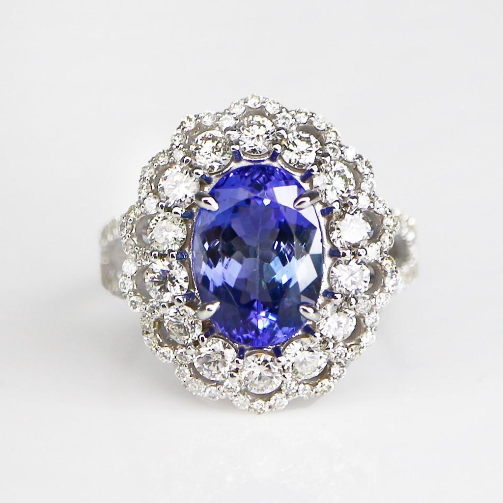 **One IGI 14K White Gold 3.00 Ct Tanzanite&Diamonds Engagement Ring**

One natural great-quality intense blue Tanzanite as the center stone weighing 3.0 ct surrounded by the FG VS accent diamonds weighing 1.29 ct on the 14K white gold double halos