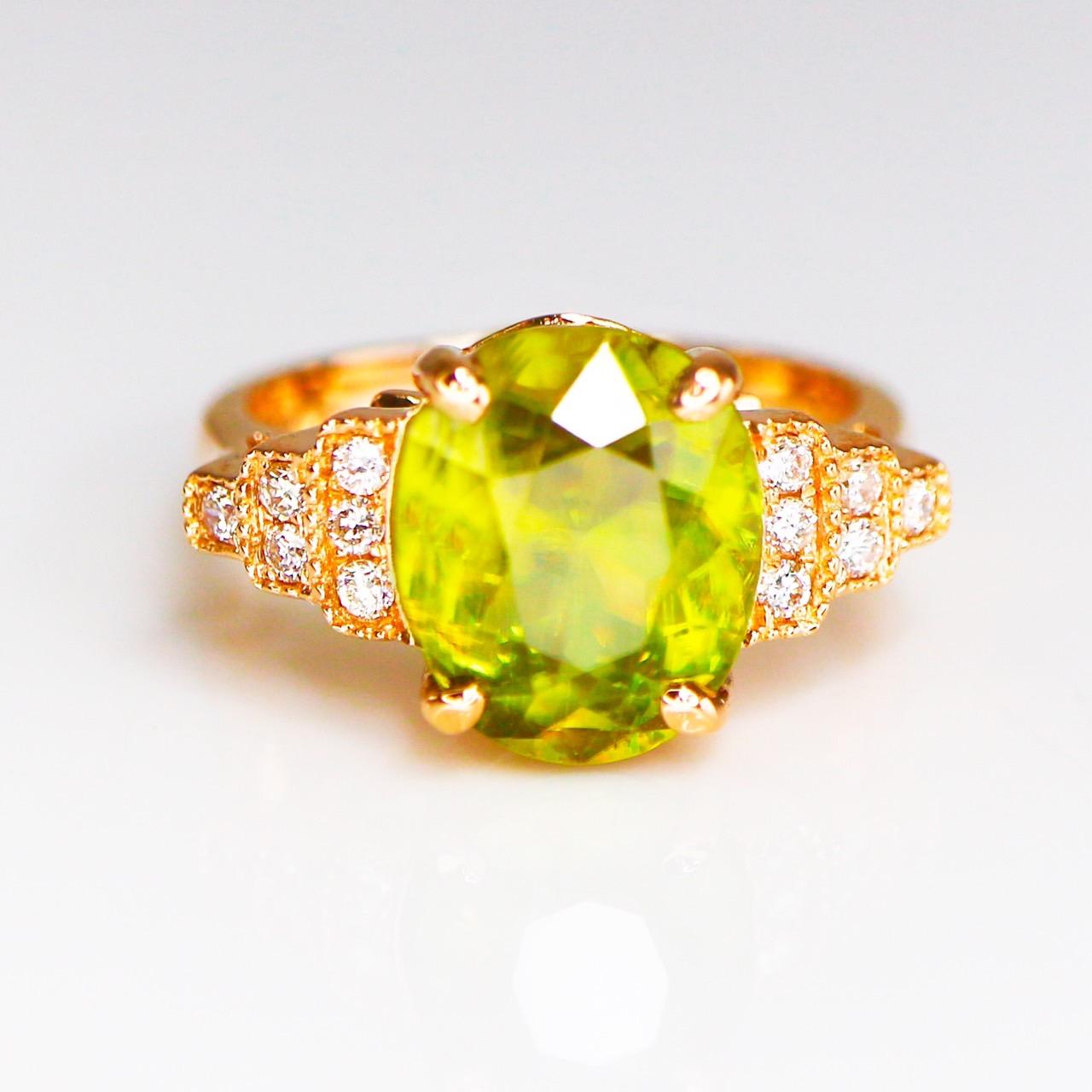 *IGI 14K 3.85 ct  Natural Color Play Sphene Diamonds Antique Engagement Ring*
This ring features a 3.85 carat natural intense yellow-green Sphene that is IGI-Certified, with a color-play effect. It is set on a 14K rose gold band and accented with FG