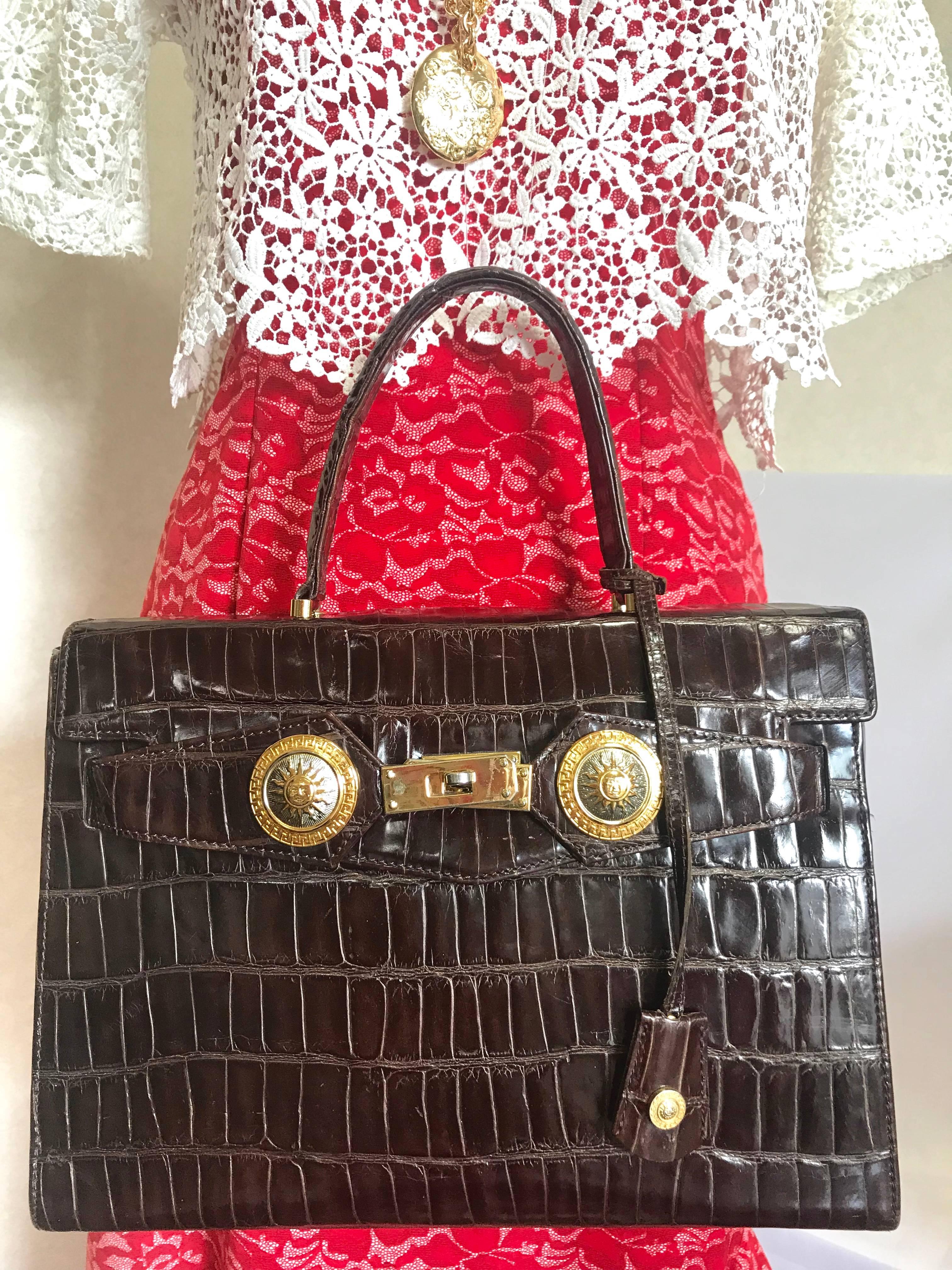 1990s. Vintage Gianni Versace dark brown croc embossed leather Kelly style bag with Medallion Sunburst motifs. Gorgeous masterpiece. Must have bag.

This is one sophisticated masterpiece from GIANNI VERSACE in the old era. 
If you are looking for