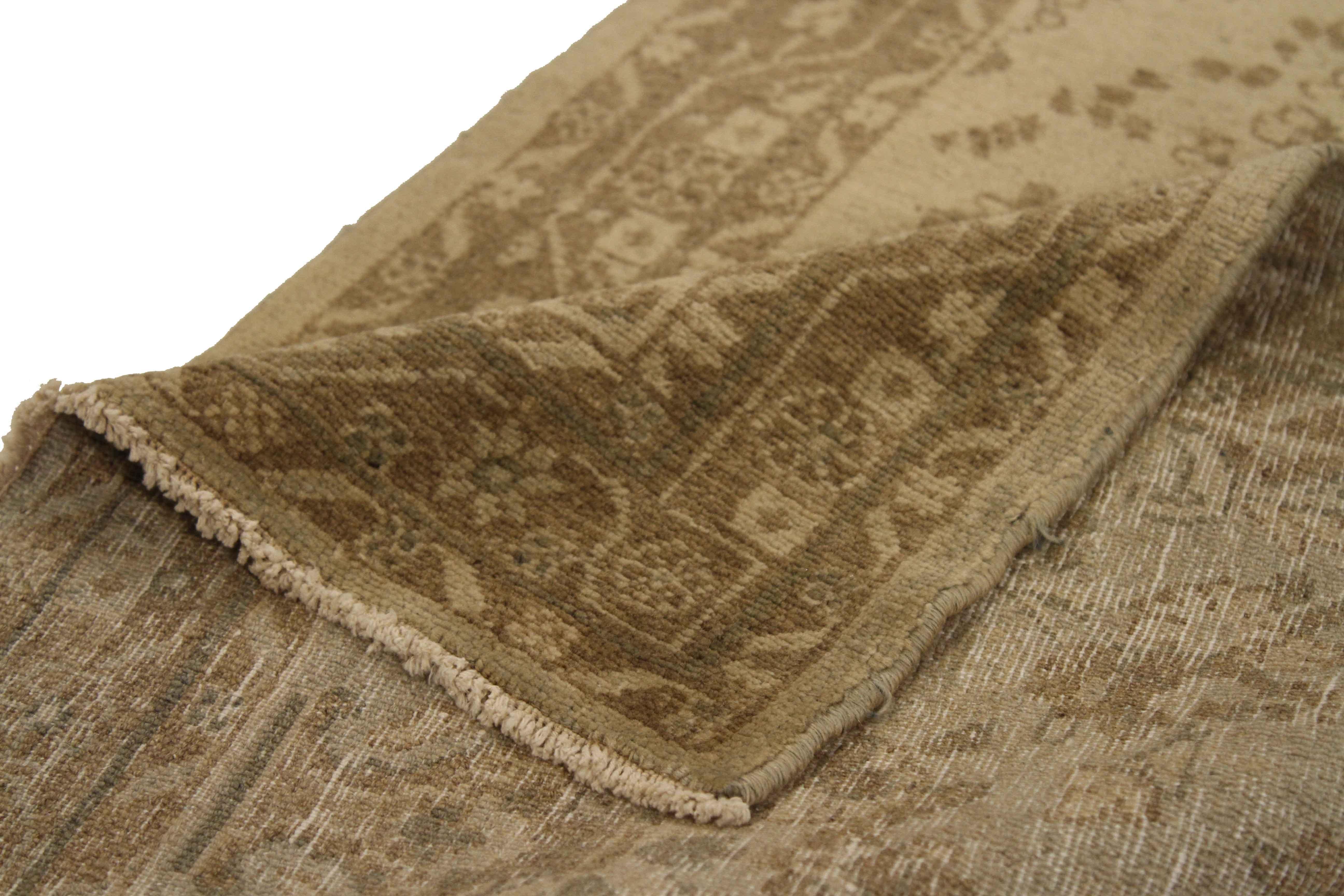 Antique Persian rug handwoven from high-quality organic wool with its exquisite surface covered with design patterns traditionally found in Hamadan carpets. It’s colored in gold, ivory, and green made from natural vegetable dye. It’s a nice option