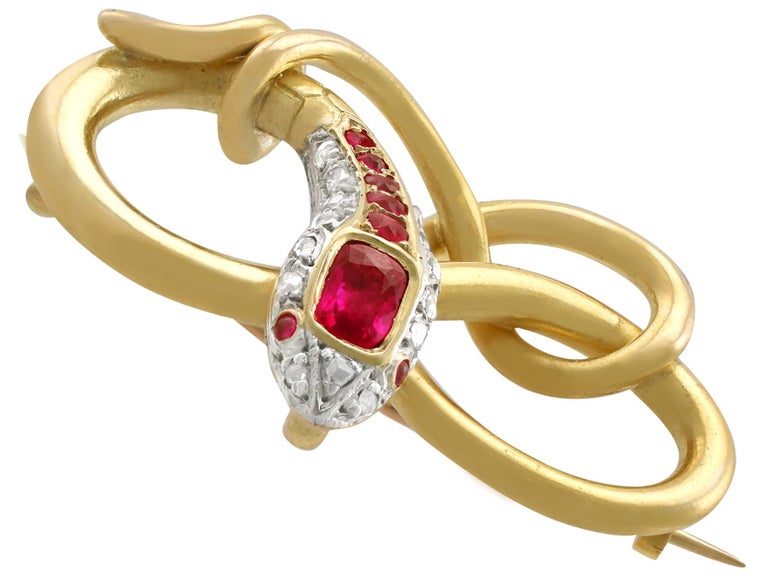 A stunning Victorian 0.59 carat ruby and 0.08 carat diamond, 22 karat yellow gold and silver set 'snake' brooch; part of our diverse antique jewelry collections

This stunning, fine and impressive Victorian brooch has been crafted in 22k yellow gold