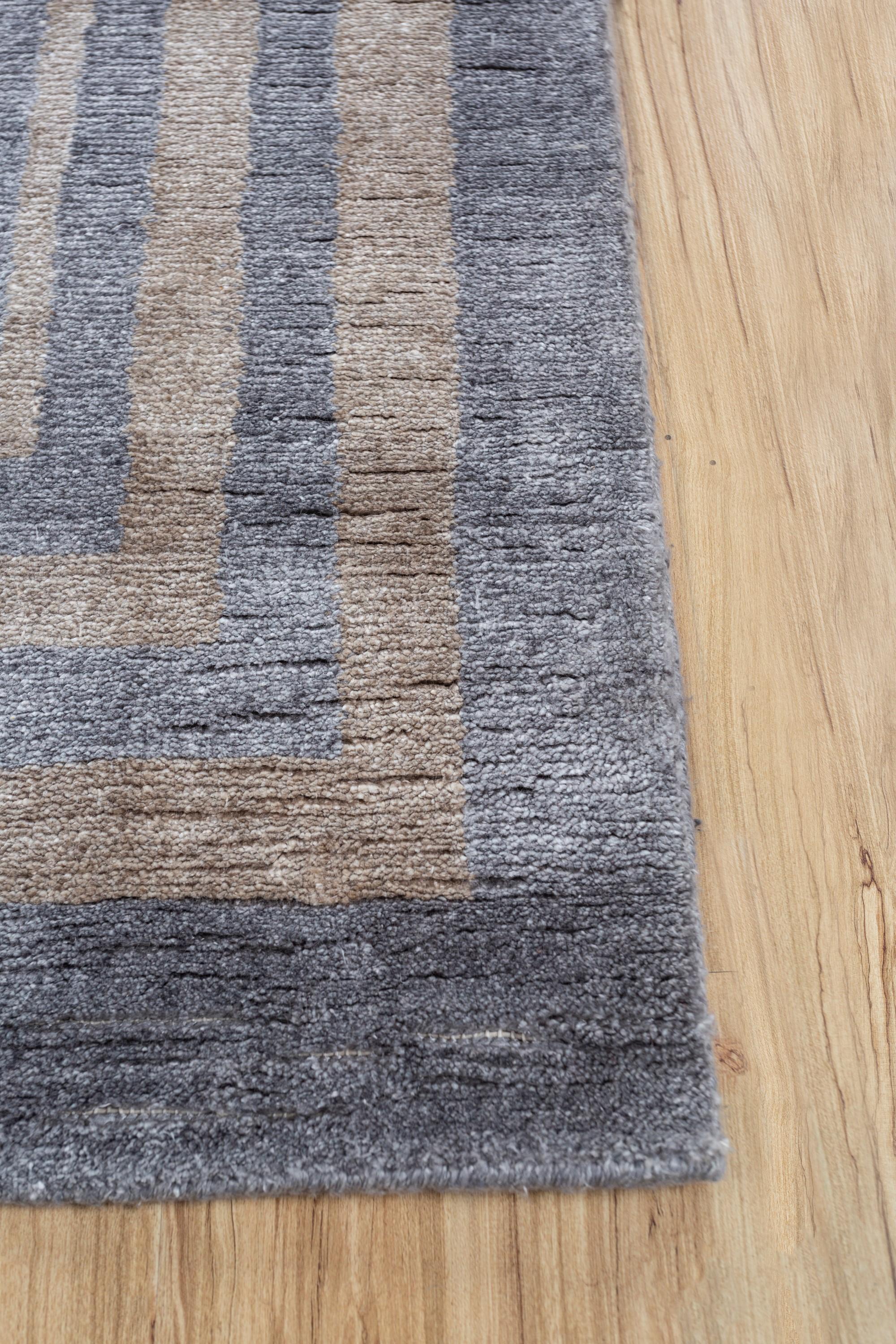 Can a rug be the key to transforming your space into a haven of tranquility? Introducing this hand-knotted marvel  designed to elevate any room. With a soothing tone-on-tone palette, this rug effortlessly uplifts the mood, adding warmth and comfort