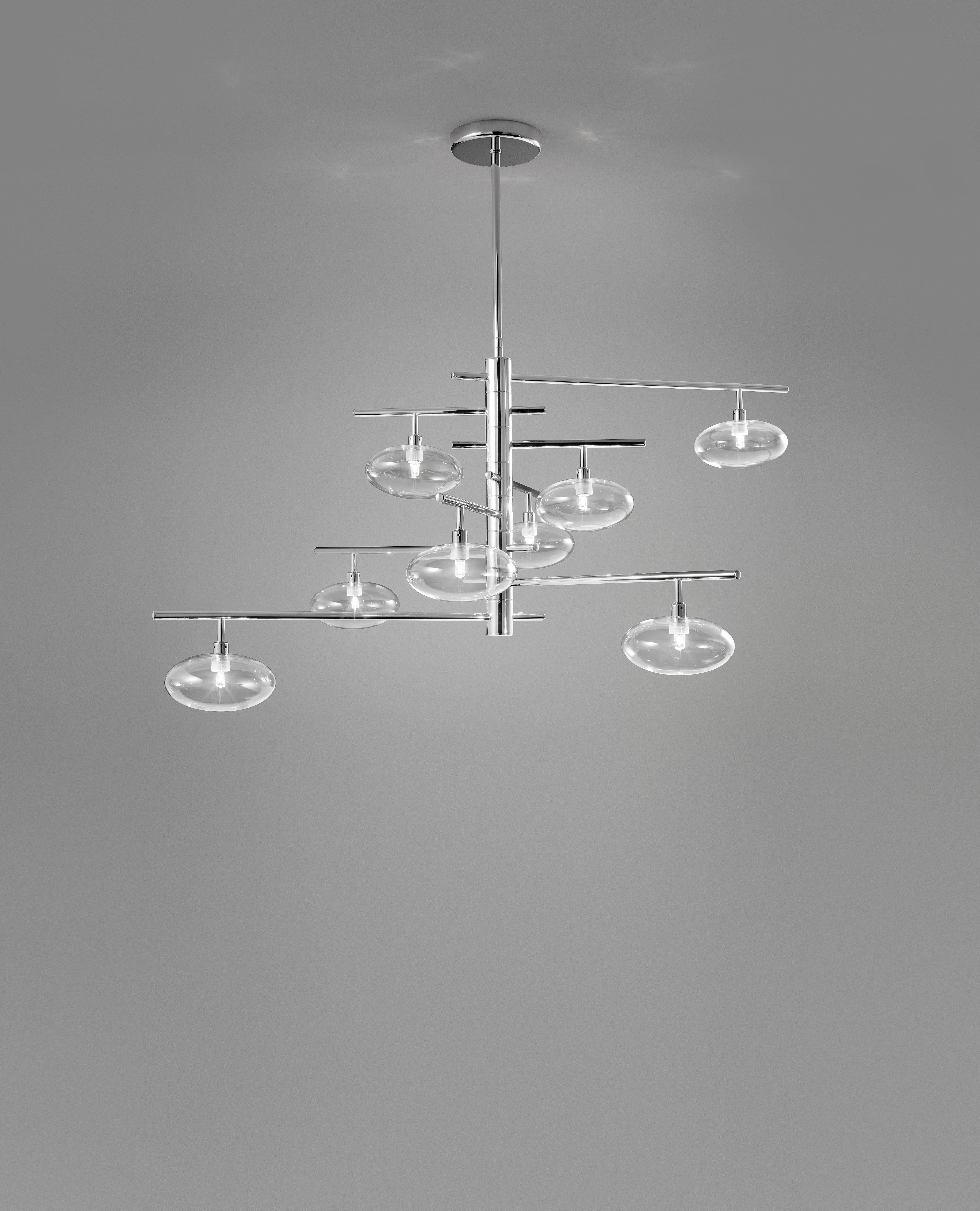 Lampadario moderno italiano o da incasso con otto paralumi in vetro trasparente montati su una struttura in metallo cromato / Prodotto in Italia da FABIO LTD
Larghezza: 43,5 pollici / Profondità: 33,5 pollici / Altezza: 35,5 pollici più asta e