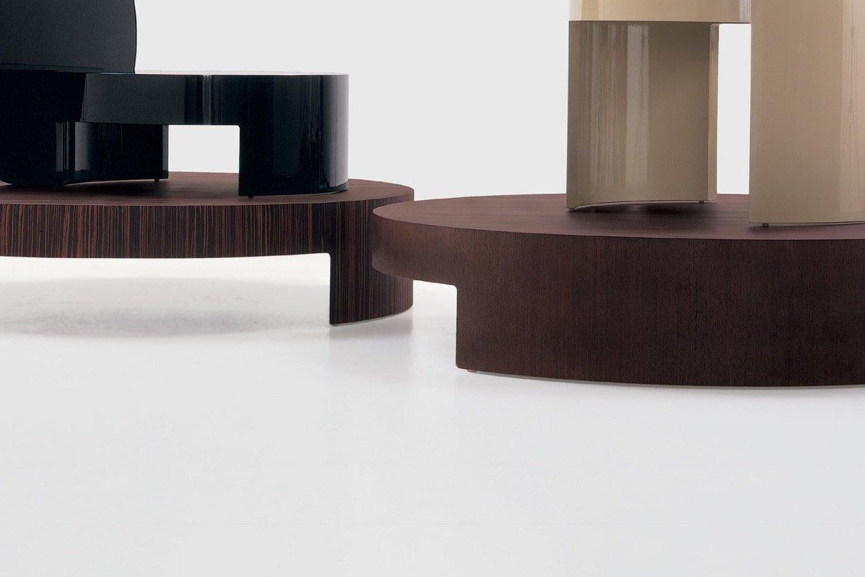 Curved multi-layered wood. Finishing available: mat or polished lacquered or veneered wood zebrano, wengé, beech wood.

Carlo Colombo is considered one of the most important Italian architects and designers. He started his career right away with
