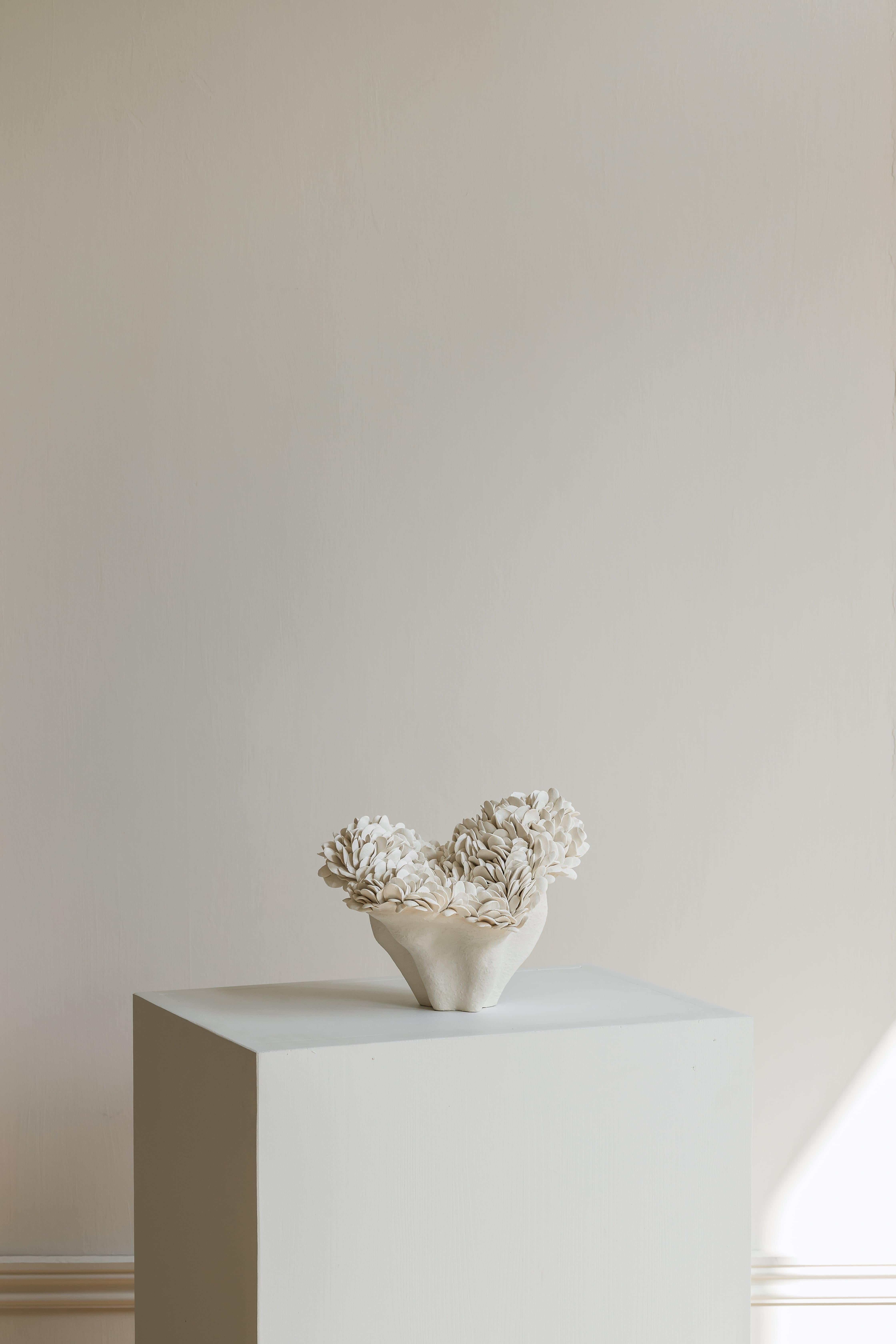 Nubes Petit sculpture by Hanna Heino
Dimensions: D 18 x W 22 x H 18 cm
Materials: Handbuilt, Stoneware Clay, Porcelain, Engobe.
Also available in different colors. 


Hanna Heino is a contemporary clay artist from Finland known for her
