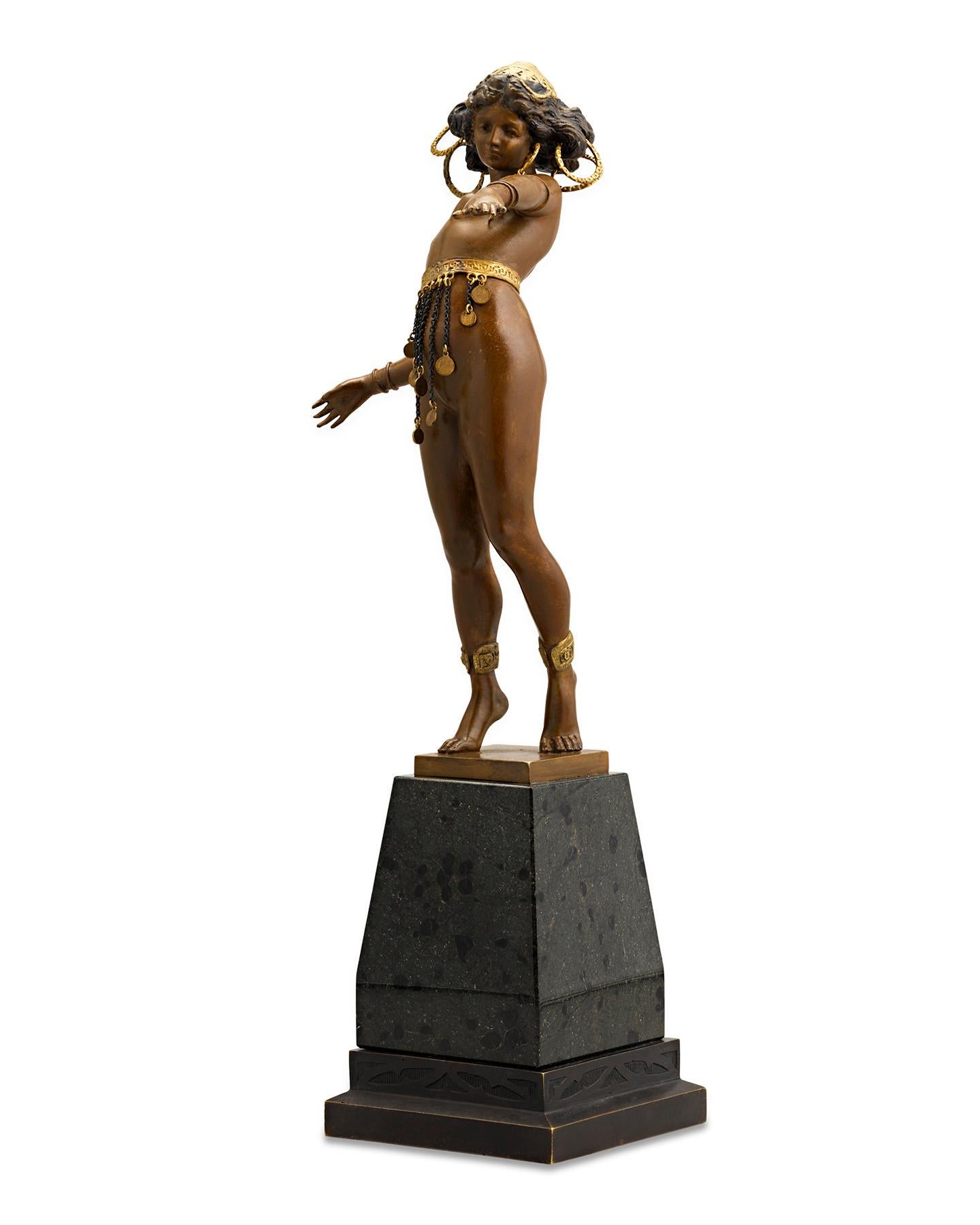 Exemplary of Art Nouveau elegance, the sensuous female form is the focus of this Viennese bronze by Austrian sculptor Carl Kauba (1865 - 1922). The intricately detailed bronze captures the supple form of an exotic Nubian dancer in a true