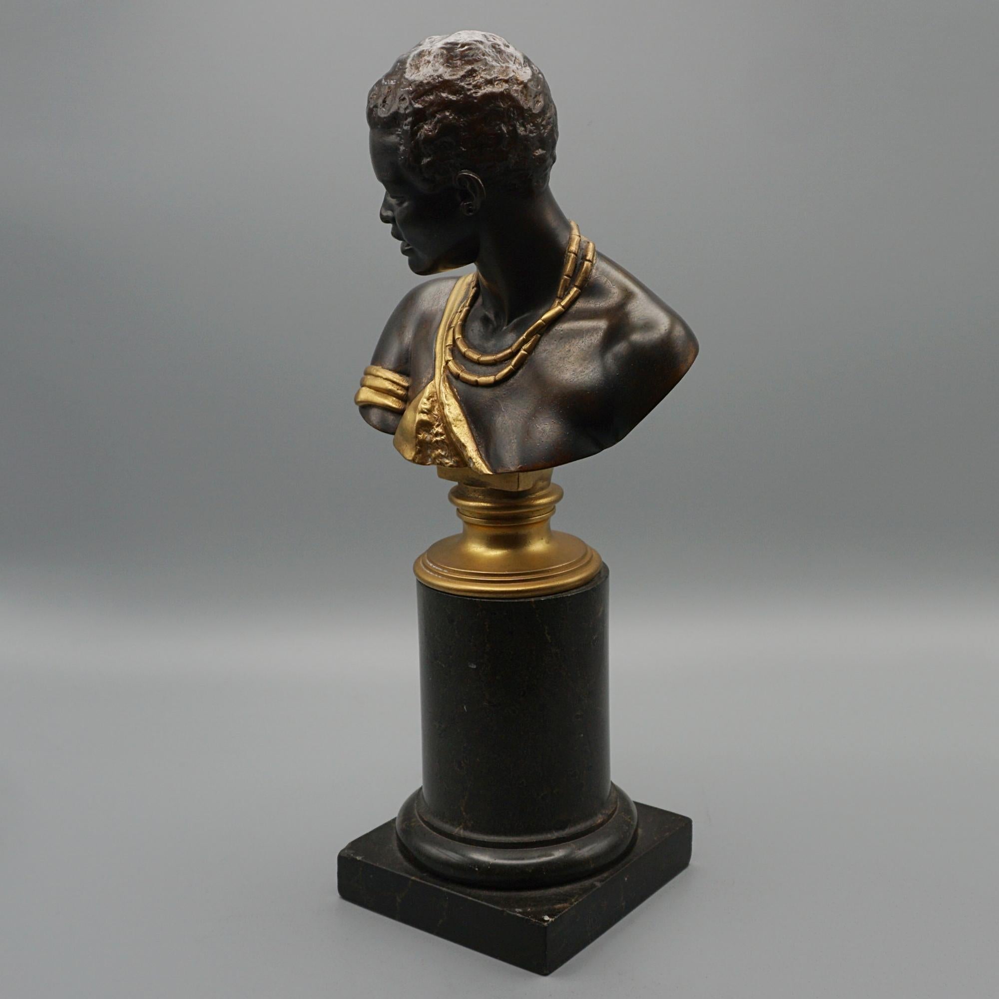 A late Victorian bust of a Nubian woman by Oskar Gladenbeck (1850 - 1921). Bronze with gilt-bronze, set over a circular marble plinth, signed to bust.

 Dimensions: H 32cm W 15cm D 10cm

Origin: German

Date: 1882

Item Number: 31072411
