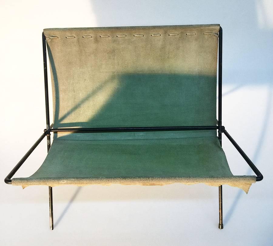 Nubuck leather magazine rack, 1970s

A magazine rack of metal with nubuck leather liner
Unknown maker
The size closed is 49 cm high and 44 cm wide
Opened is it 31 cm high, 44 cm wide and the depth  39 cm 
Frame shows some age wear and missing one of