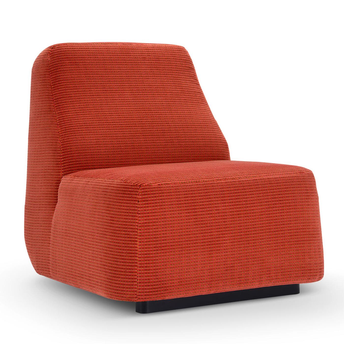 Inspired by a sense of simplicity - as suggested by its name meaning bare or nude in Italian - this lounge chair promises utmost comfort with its plush volumes. A plinth base sustains its silhouette, which progressively tapers towards the top