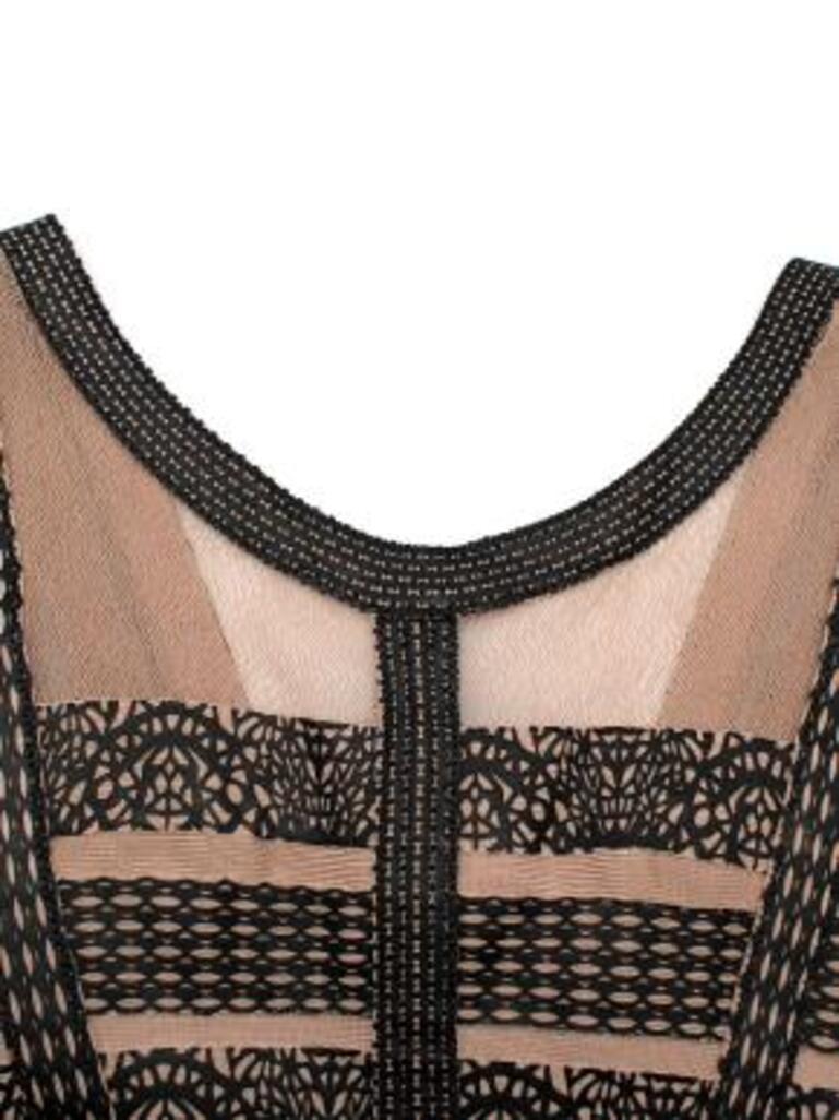 Herve Leger nude and black leather embellished dress
 

 - Leather overlay on a mesh back
 - mid-weight
 - fitted classic bandage style
 - Zip at the back.
 

 Made in China.
 Do not dry clean, spot clean. 
 Condition 9.510.
 

 PLEASE NOTE, THESE