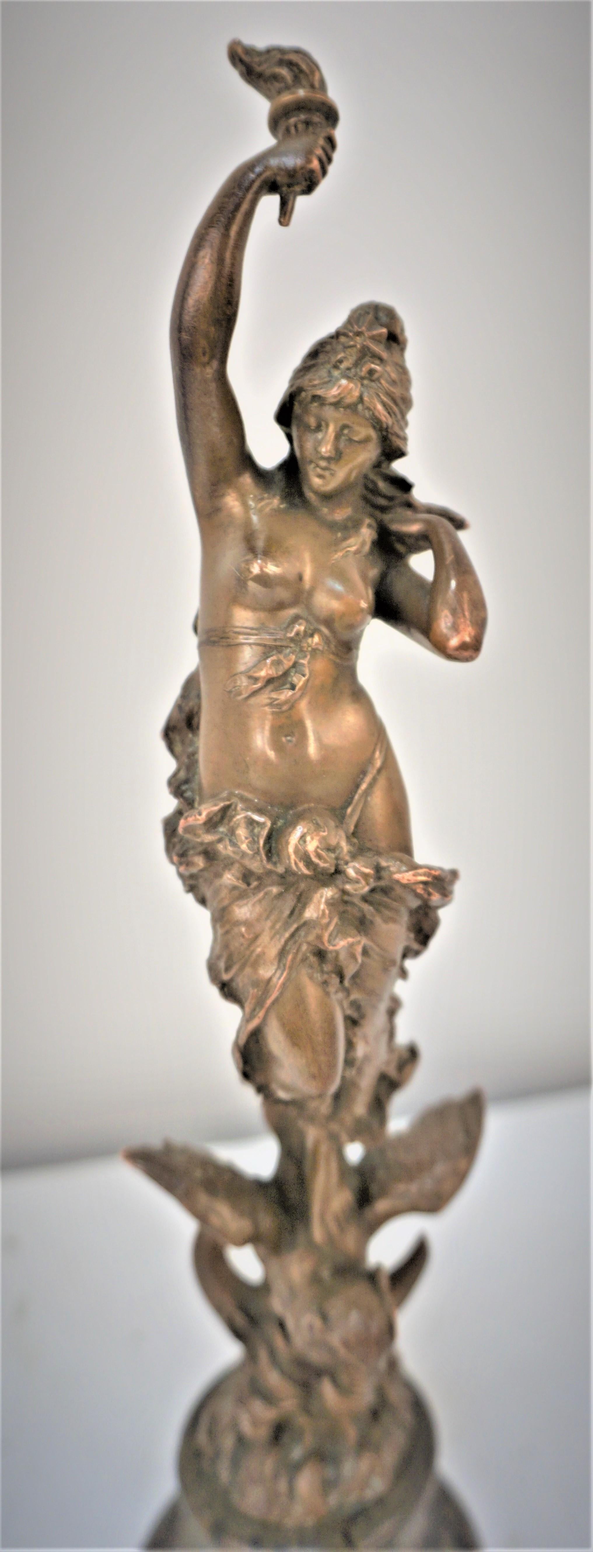 Beautiful art nouveau bronze sculpture of nude figure standing on Owel with marble base.
By Paul Aichele 1859-1920.