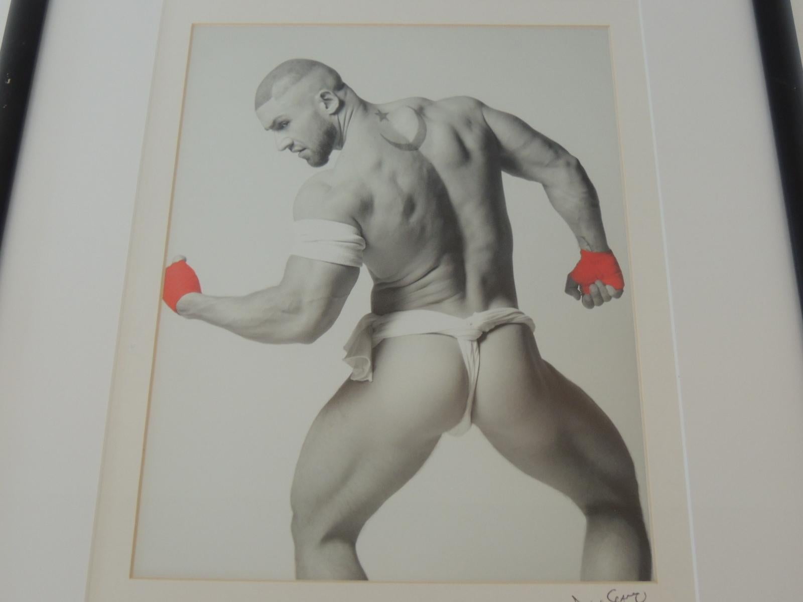 Nude black and white abstract photograph of male with red gloves.
aka. Adult film star Francois Sagat.
Black vintage lacquered wood frame and museum quality white mat.
(glass)
Found in Orlando Florida. (Local Photographer)
Size of photo: 8