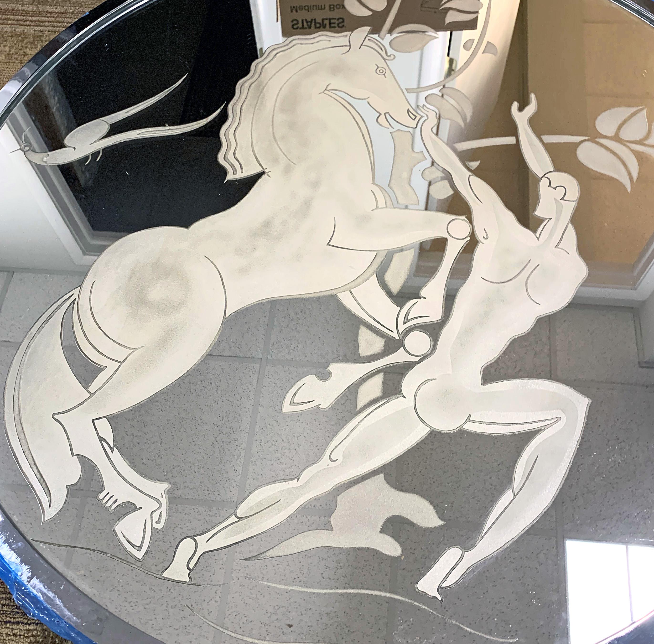 The only example we have ever seen, this large and impressive Art Deco Mirror depicts a nude male figure bounding joyfully with his horse, a leafy tree in the background and birds flying overhead. The round shape of the mirror and the mythological