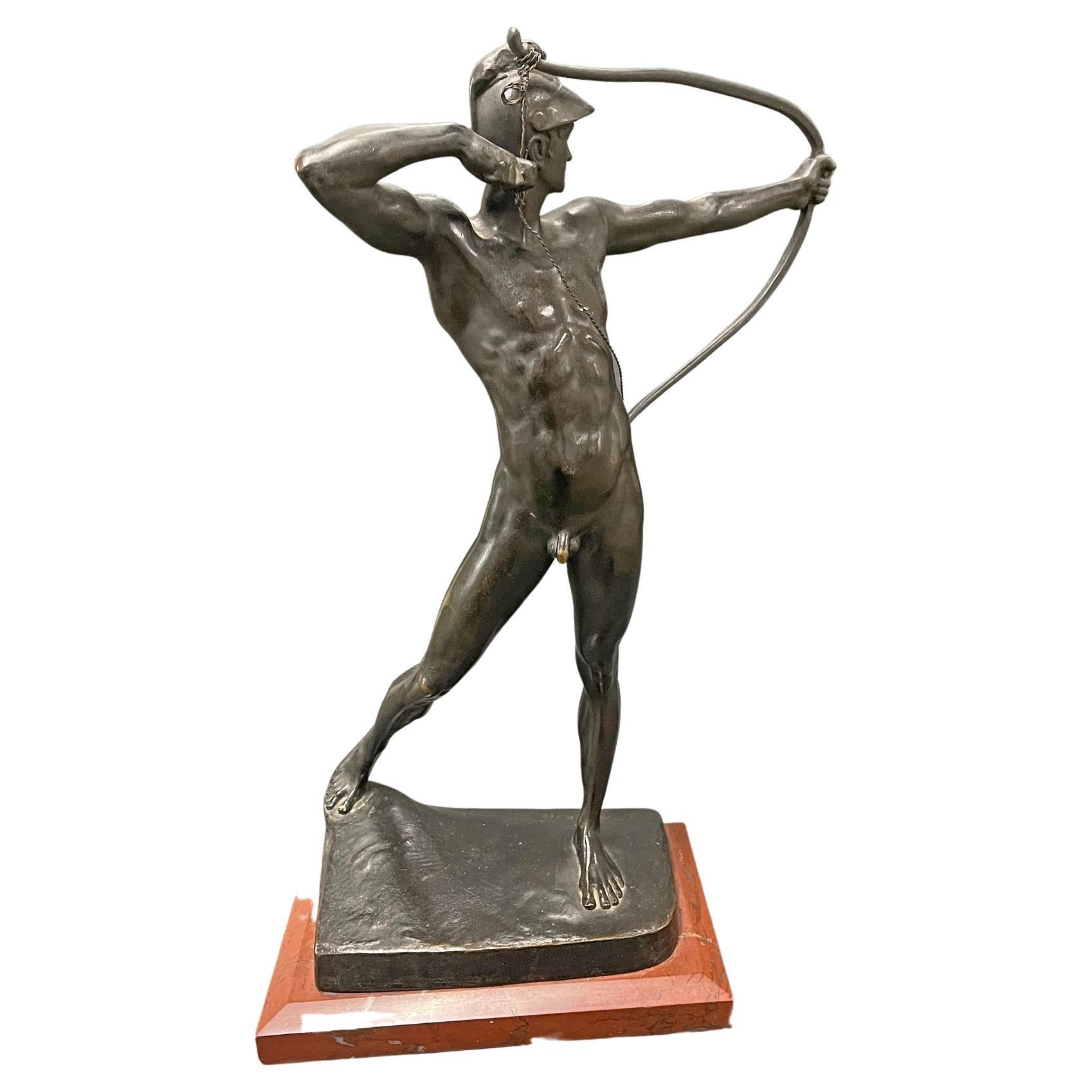 Brilliantly sculpted and cast with very fine detail with a rich, lustrous patina, this celebrated bronze of a fully nude male archer was sculpted by Ernst Moritz Geyger in the 1890s and cast around 1900. His original, large bronze was exhibited at