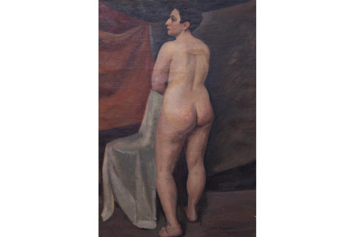 Cette peinture à l'huile de Józef Krzyżański, mesurant 79 x 53 cm, présente une étude de nu saisissante rendue avec une humeur calme et introspective. Enracinée dans la technique classique, la composition reflète la formation académique de