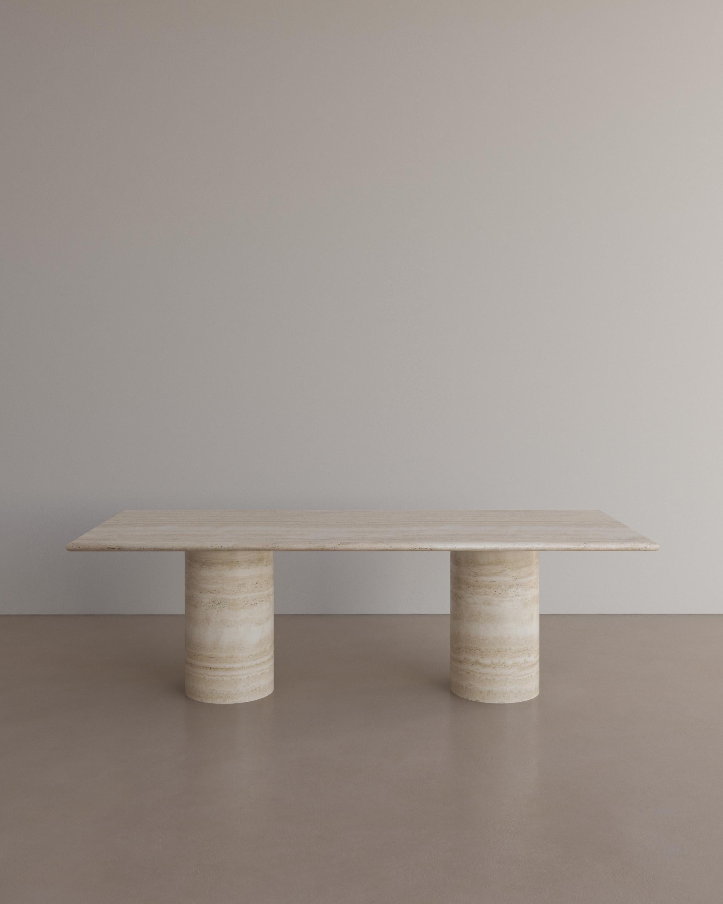 The Voyage Dining Table II in Nude Travertine by The Essentialist celebrates the simple pleasures that define life and replenish the soul through harnessing essential form. Envisioned as an ode to historical elegance, captured through a modern lens
