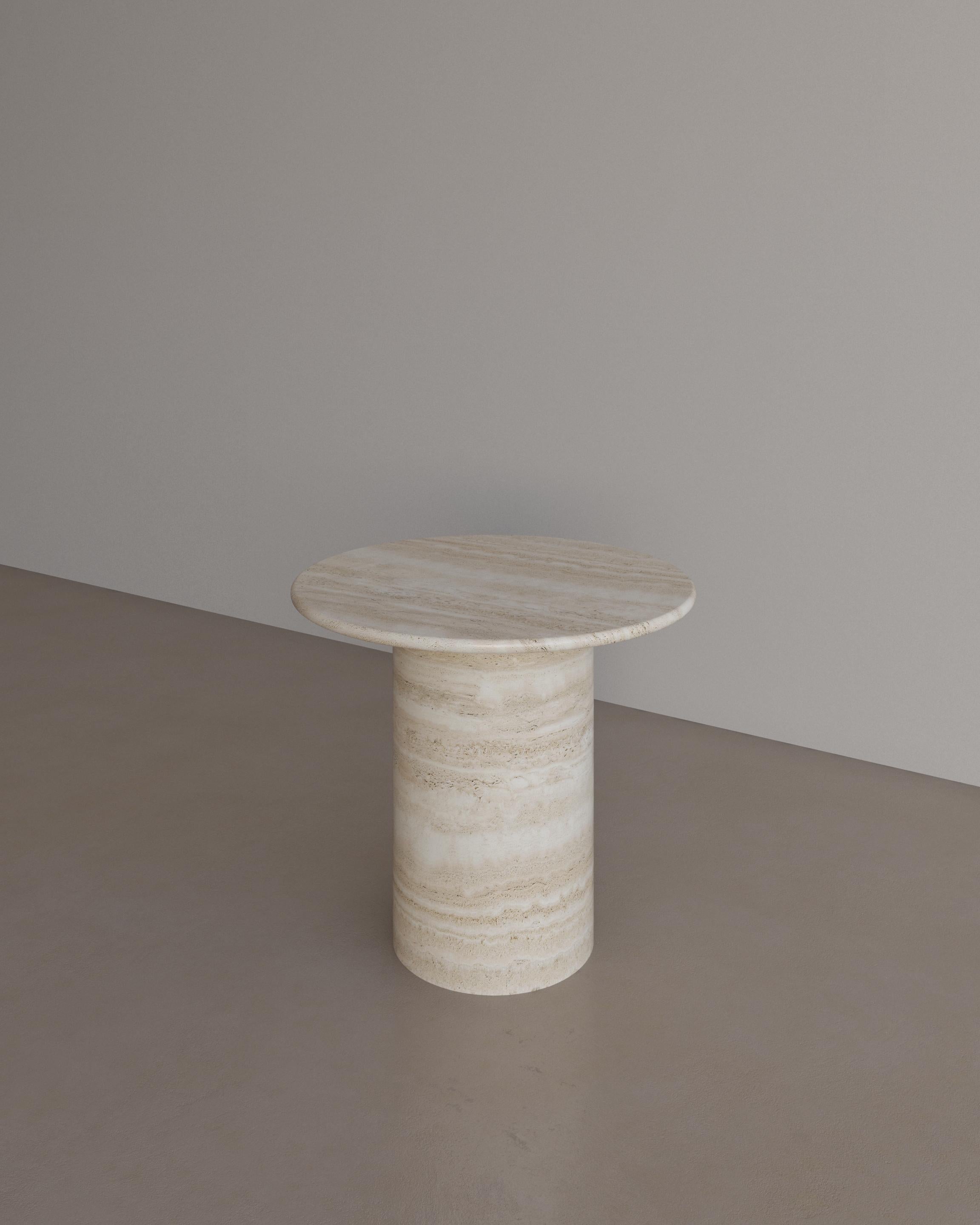 The Essentialist presents the Voyage Occasional Table I in Nude Travertine. 
The Voyage Occasional Table I celebrates the simple pleasures that define life and replenish the soul through harnessing essential form. Envisioned as an ode to historical