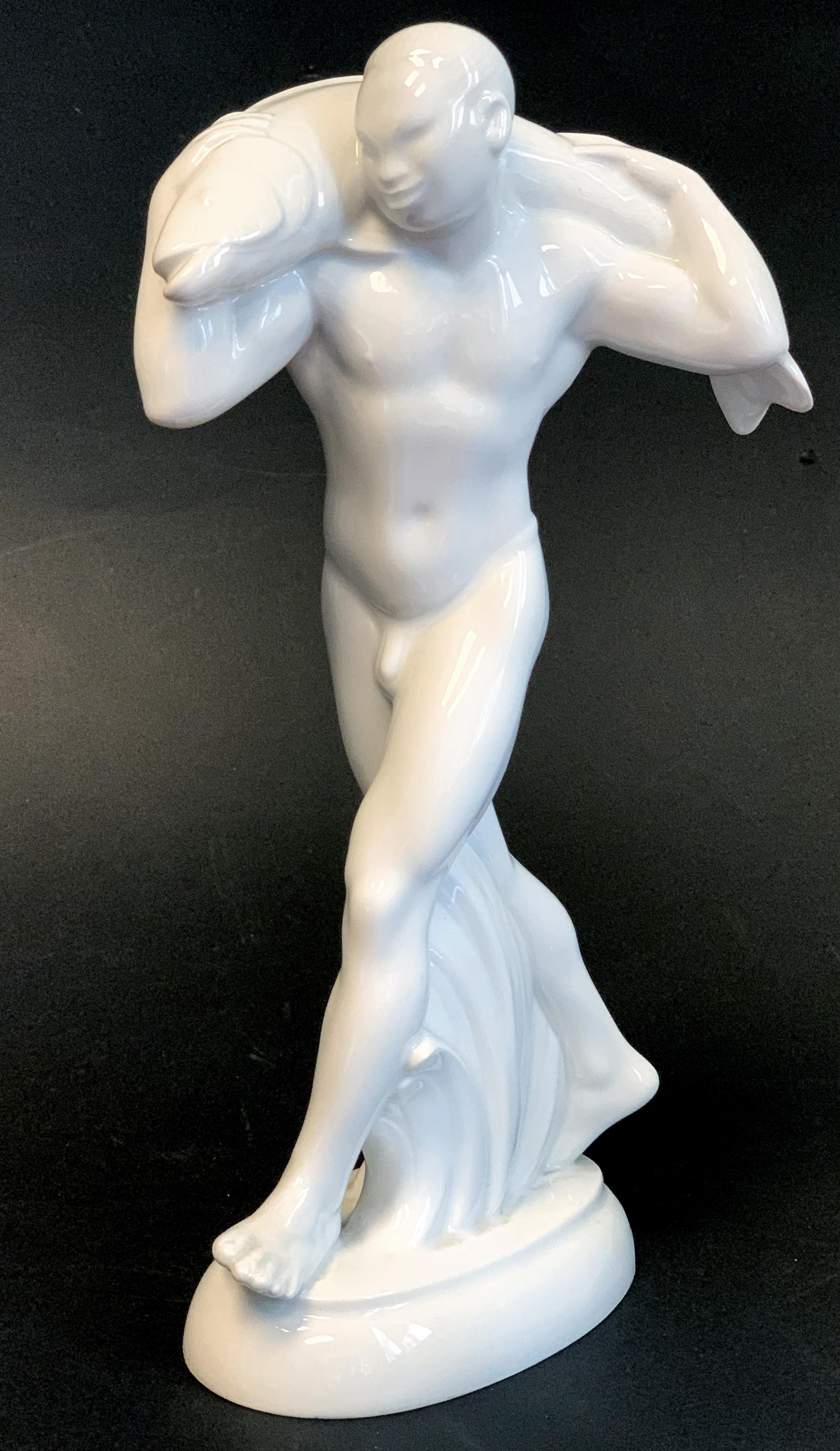 Rare and striking, this porcelain sculpture depicting a nude Japanese male figure carrying a fish on his shoulders was sculpted by Adolf (or Adolph) Amberg for KPM in 1905, to celebrate the wedding of Prussian Crown Prince Wilhelm to Duchess Cecilie