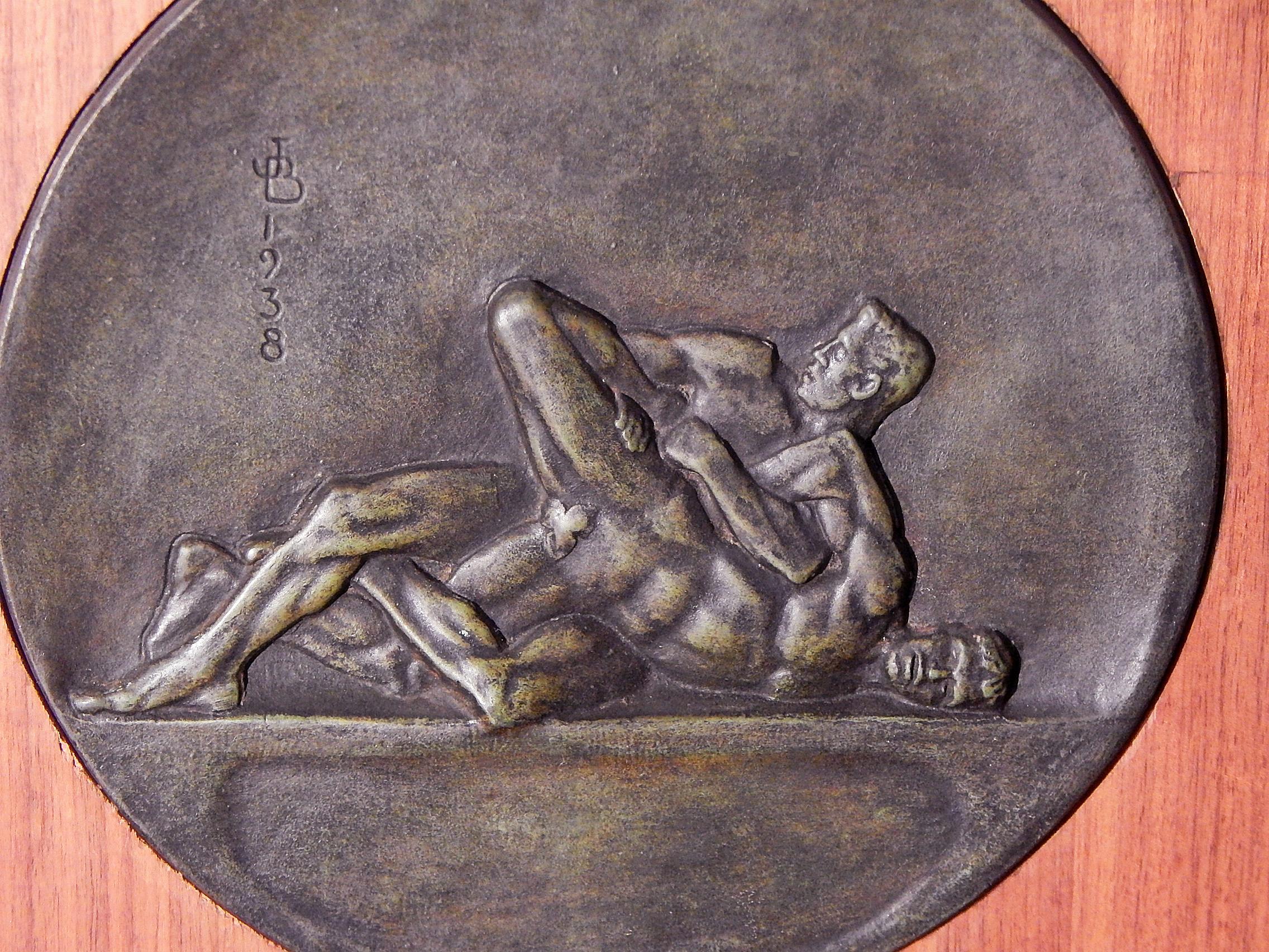 Extremely rare and very early in the career of Joe Brown, who followed R. Tait McKenzie as America's leading sculptor of athletes in action, this 1938 bronze rondel was sculpted just a year after Brown was named boxing coach at Princeton University.