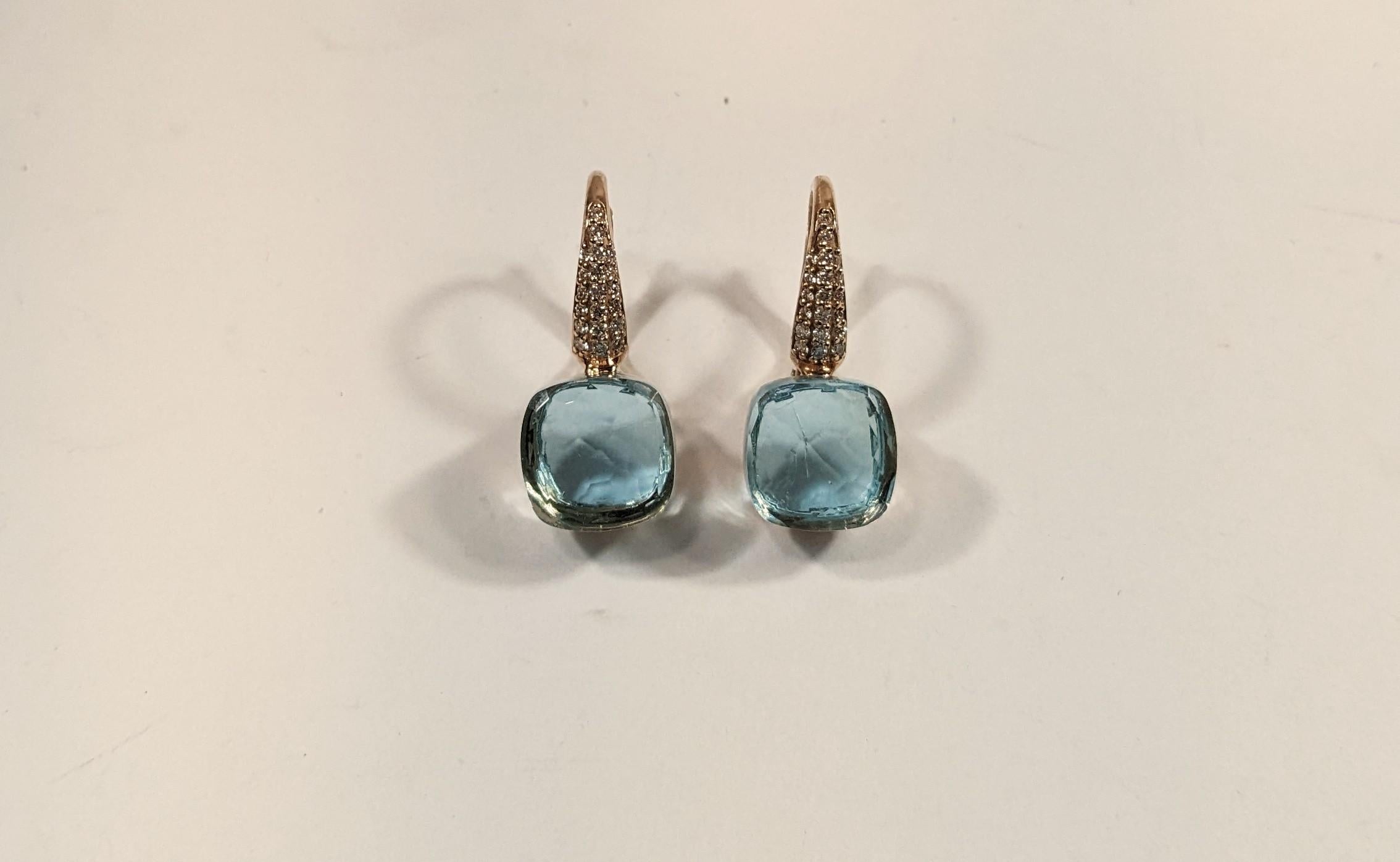 Pendientes Nudo de oro rosa de 18 quilates, diamantes y topacio
Acabados en oro amarillo, rosa o blanco de 18 quilates 
Peso total de los pendientes 7,2gr 
y miden 22 mm o 0,75 pulgadas
Diamantes  0,22 ct
Peso Oro  5,02 gramos
 Nudo  piedra,