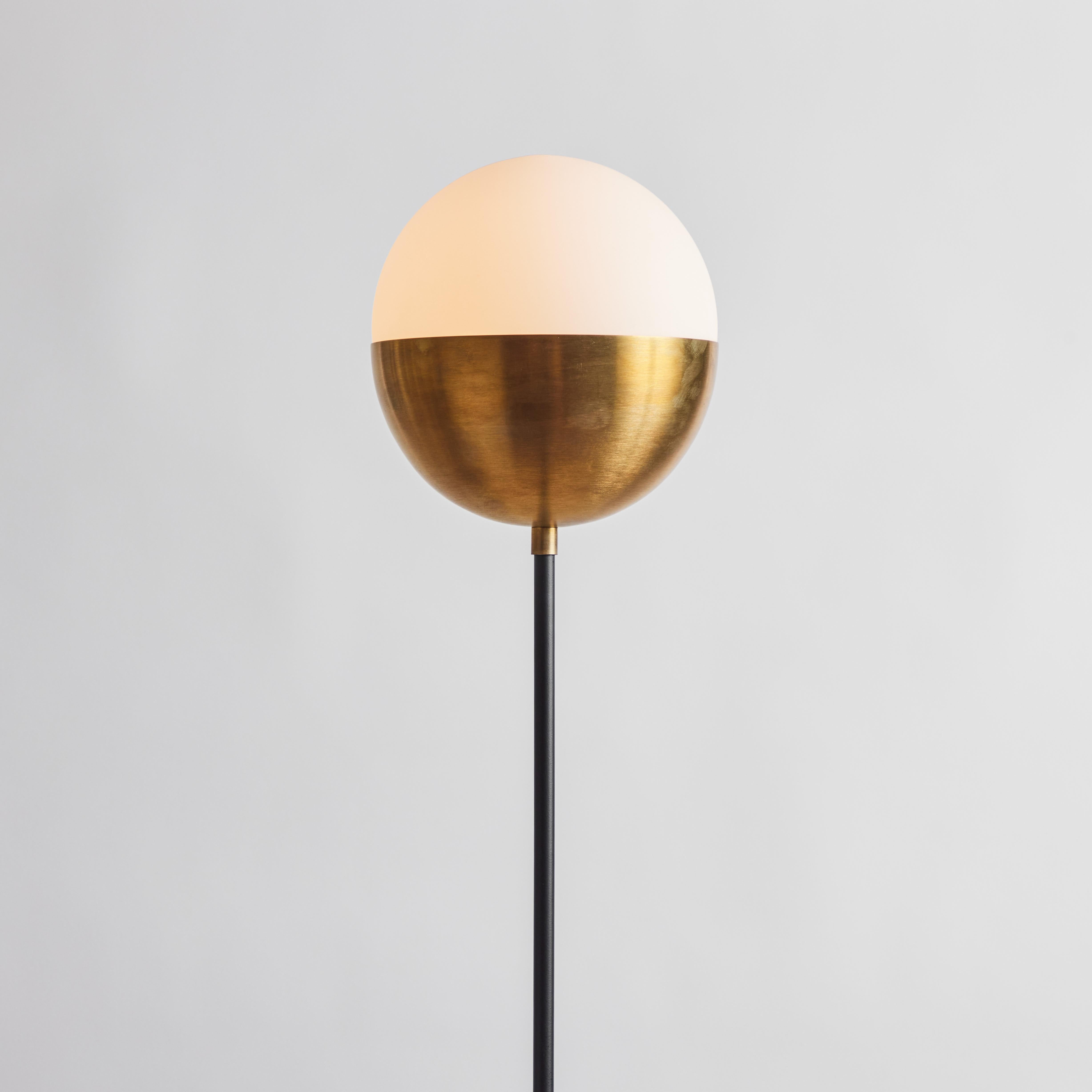 'KOKO' floor lamp in opaline glass & brass by Alvaro Benitez. 

Hand-fabricated by Los Angeles based designer and lighting professional Alvaro Benitez, this highly refined floor lamp is reminiscent of the iconic midcentury Italian designs of