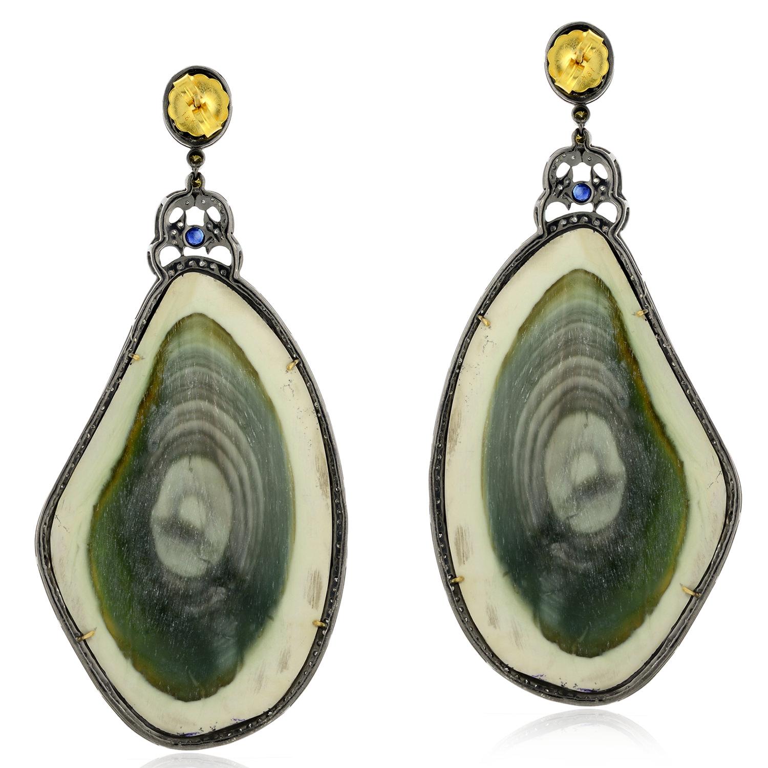 Add a touch of sparkle to your look with these unique earrings featuring sliced jasper stones, dazzling sapphire & diamond accents, and a luxurious mix of 18k gold & silver. Secure and comfortable lever back