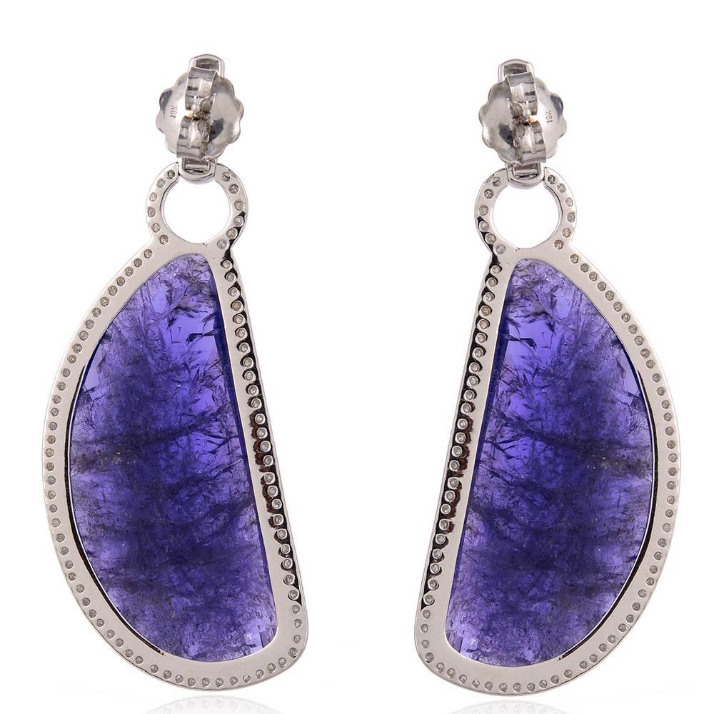 One of a kind stunning D shape sliced Tanzanite Earring with pave diamonds around in 18K white Gold.

Closure: Push Post

18kt:11.43gms
Diamond:1.96cts
Tanzanite:92.95ct