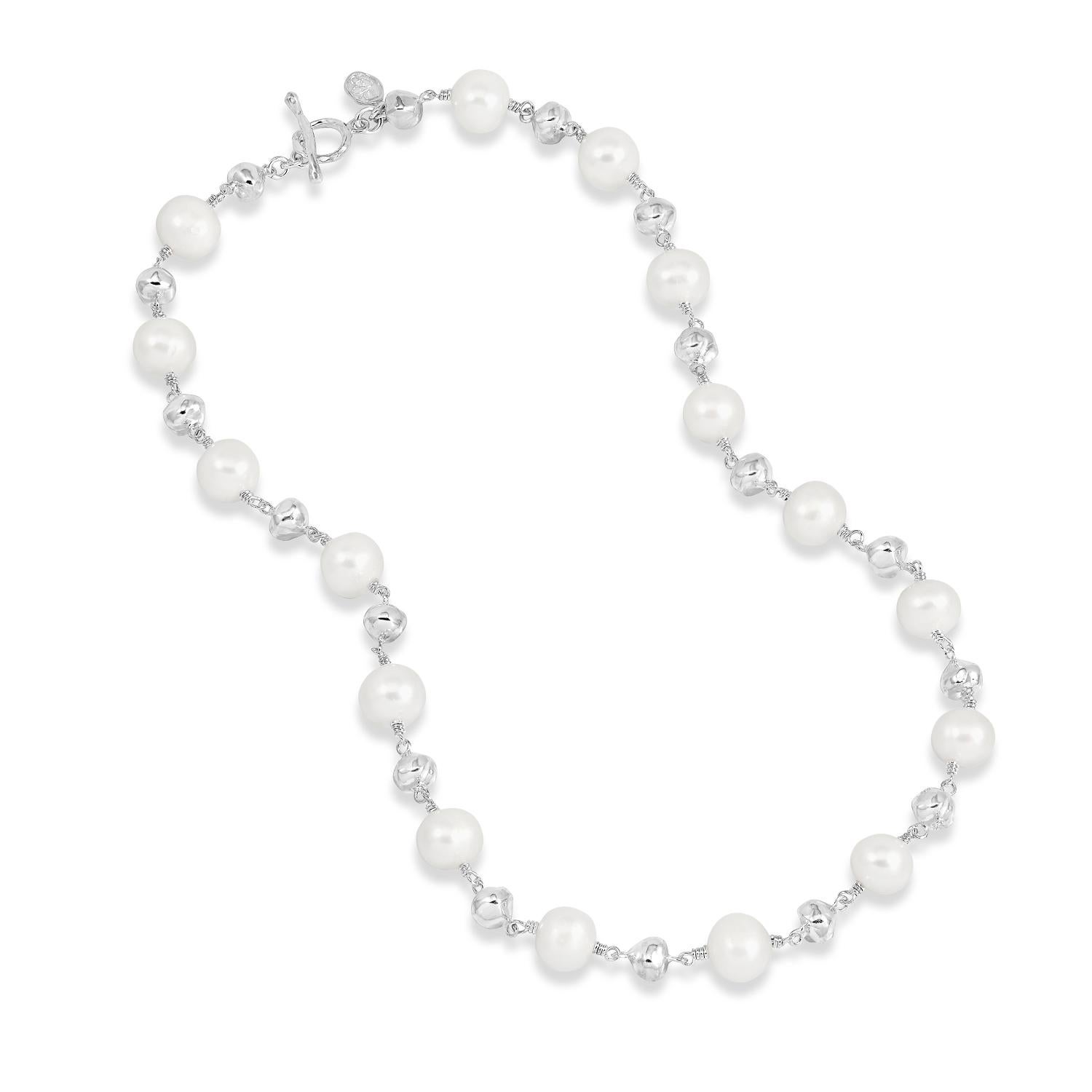 From our Luna Pearls range, this necklace features white cultured freshwater pearls interspaced with sterling silver nuggets. The 5mm nuggets have a soft beaten finish, giving the necklace an organic yet contemporary feel. The necklace is finished