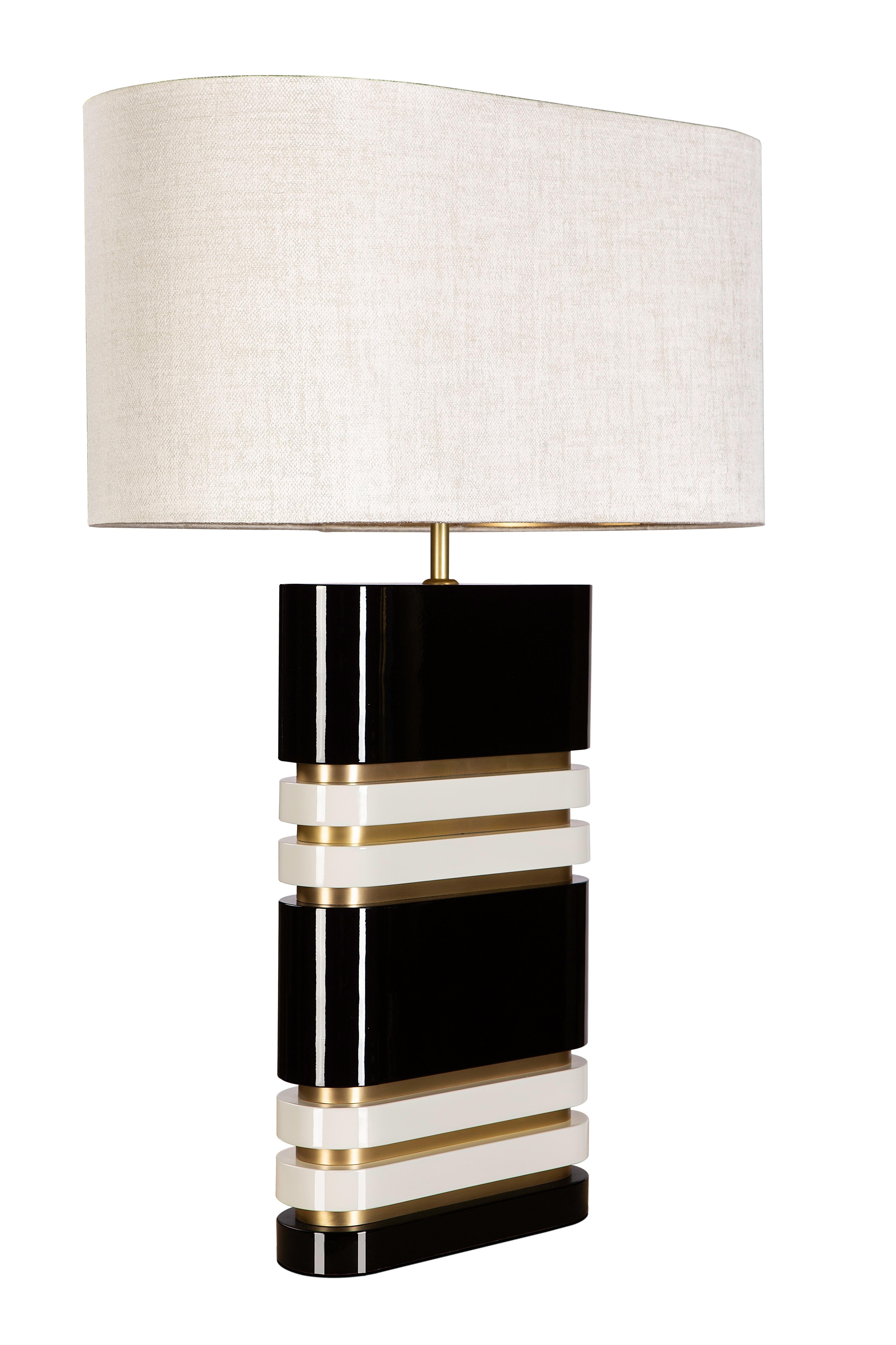 Nuit Table Lamp by Memoir Essence
Dimensions: D 25 x W 50 x H 70 cm.
Materials: Brushed brass, high gloss lacquer and satin fabric.

Nuit table lamp is a classic and elegant solution for your living room or bedroom. Its shaped silhouette and color