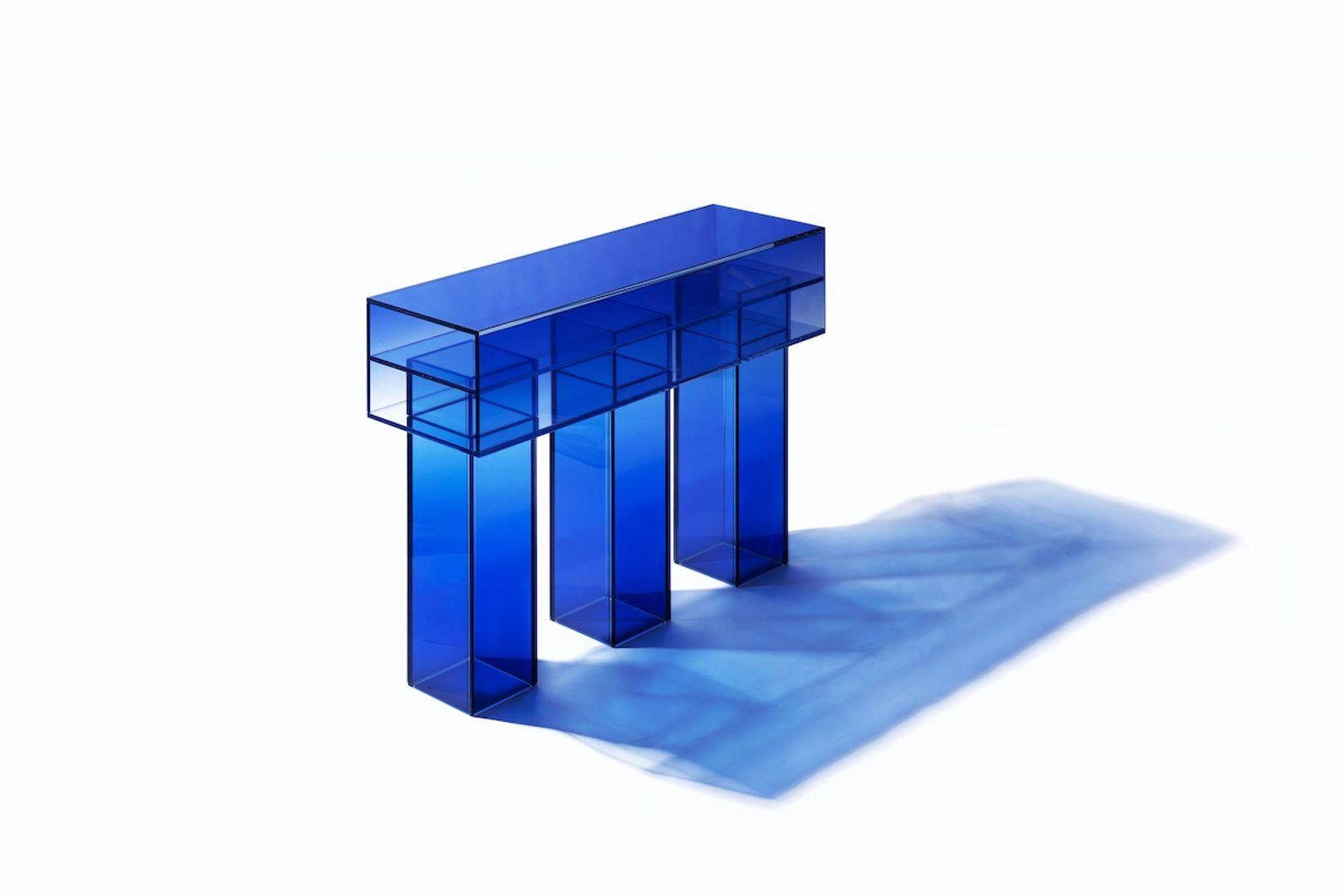 This long square bench is made with compound glass in blue color. Size and color are customizable upon request. 

Studio Buzao is an experimental design studio. It tempts to breakthrough the difference between product and artwork by immersing the
