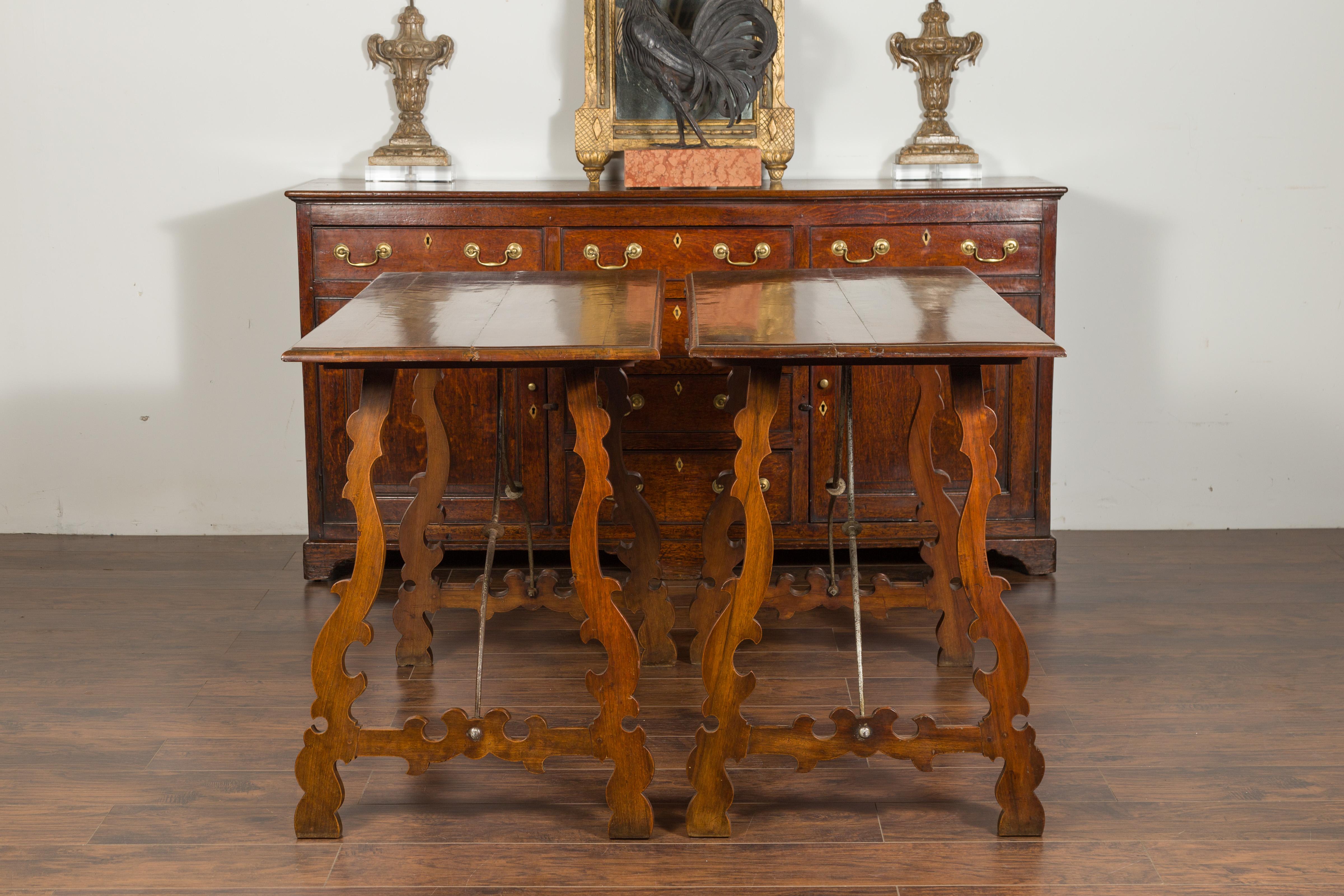 Pair of Spanish Baroque Style 1880s Walnut Console Tables with Iron Stretchers In Good Condition For Sale In Atlanta, GA