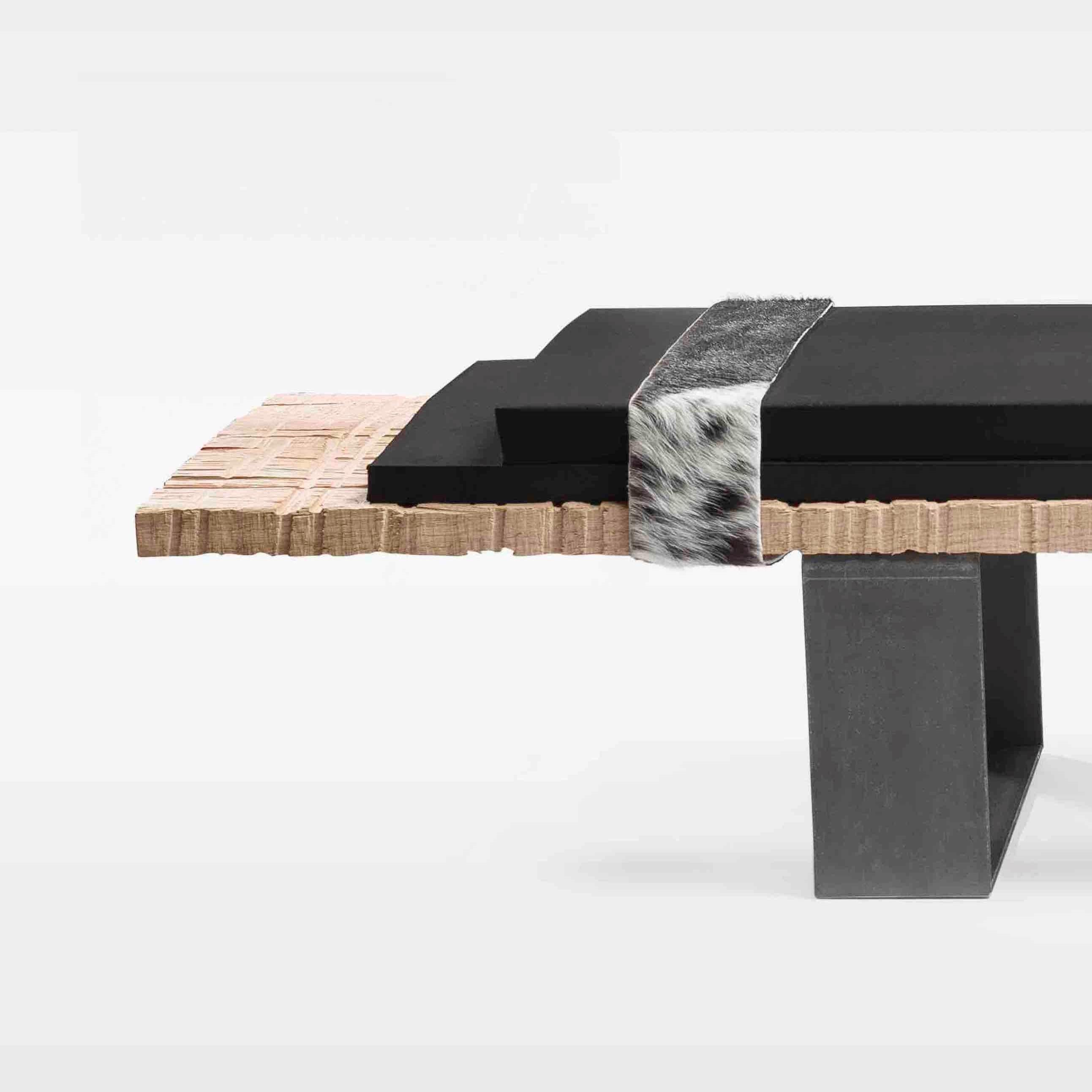 Numero 7 bench by Isola Design
Dimensions: W 200 x D 38 x H 34 cm
Materials: Carved raw oak, EPDM foam leather, Skin, feet in oiled raw steel.
Options: burnt wood, brass foot (not included in price).

You can choose your own