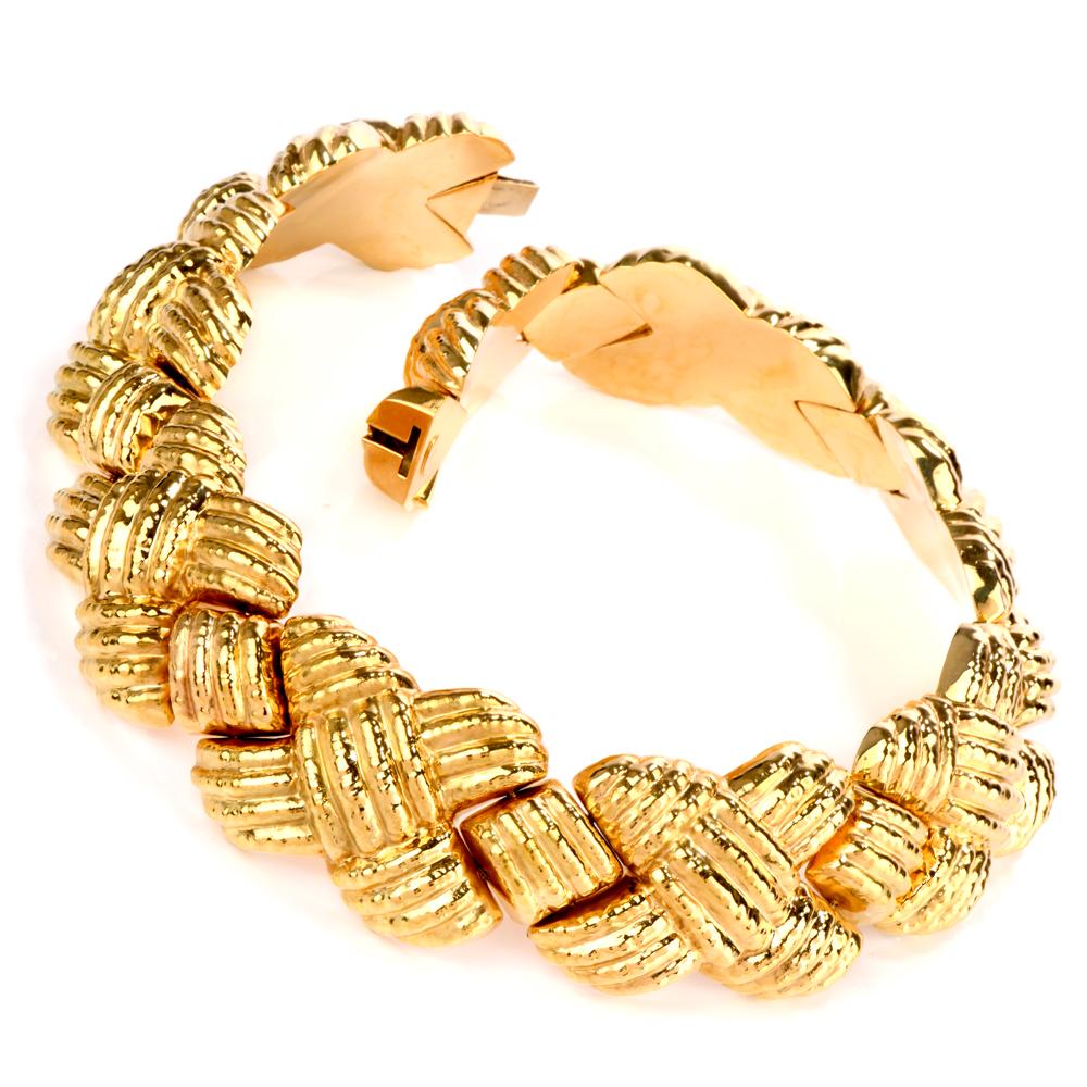 This wide Itallian designer Nuovi Gioielli collar choker Necklace was crafted in 

140.8 grams of 18K gold. 

Featuring a wide criss cross pattern throughout and 

hand embellishments of a hammered finish.

This wide choker necklace can set the