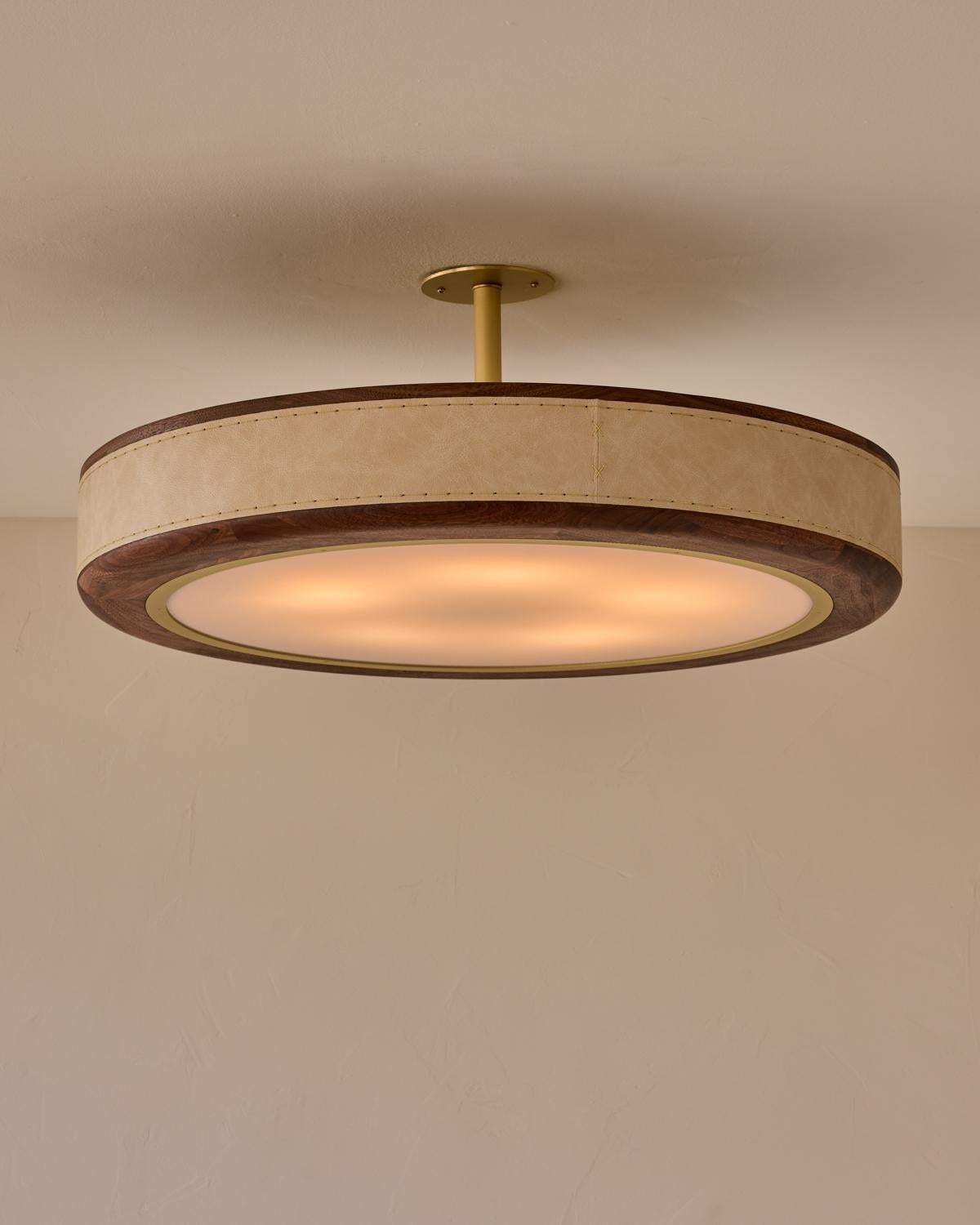 The Nura Ceiling Fixture combines hand-stitched leather over walnut accented by a brass pole and canopy. This fixture can either be hung as a ceiling surface mount or a pendant supported by a brass pole.

OVERALL DIMENSIONS
Shade: 30
