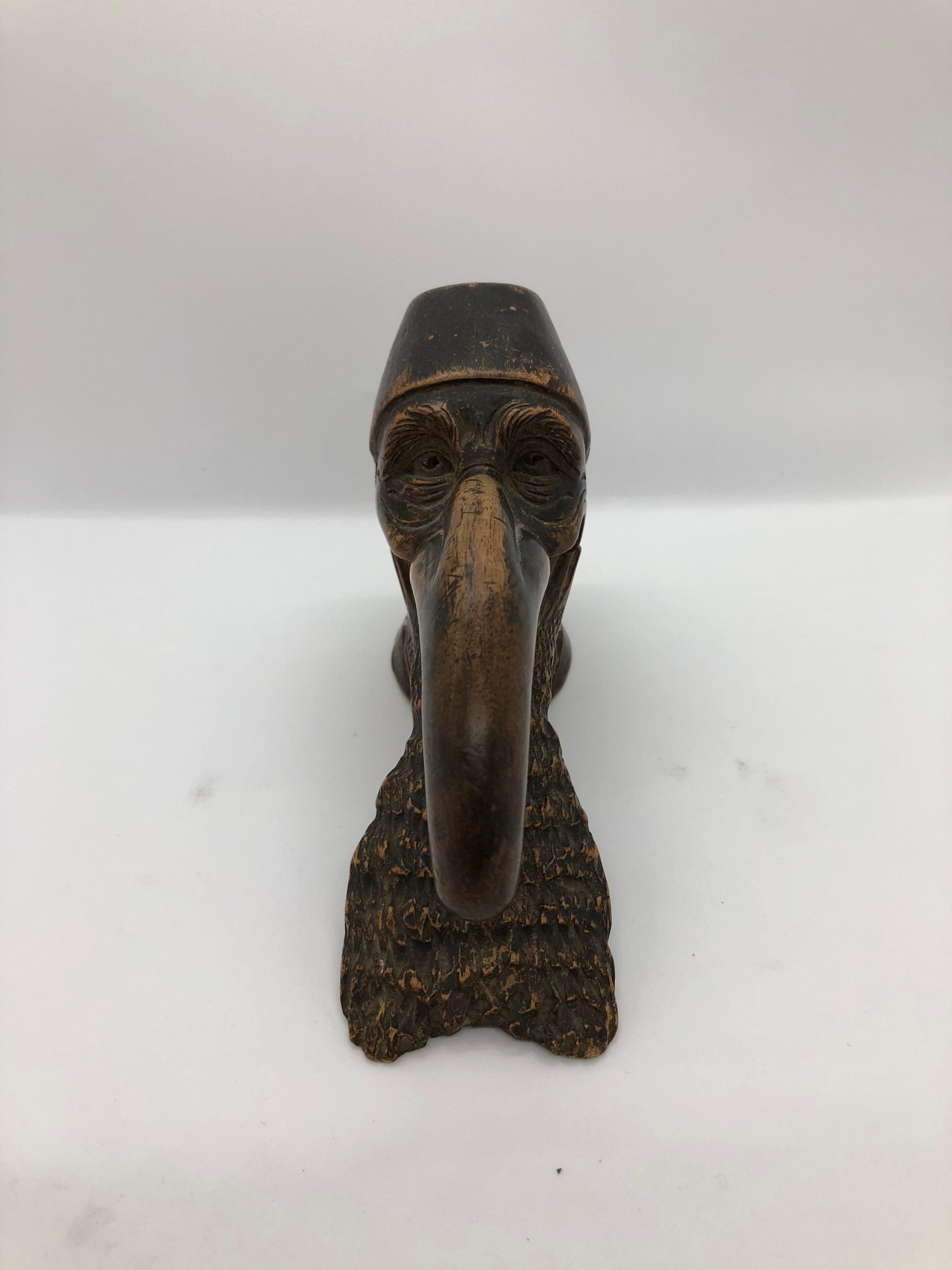 A sculptured wood nutcracker in the shape of a mans head. Very humoristicallly designed and carved. Probably Swiss.
Marked 