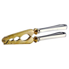 Nutcracker in gilded silver on the jaws and handles with raised friezes