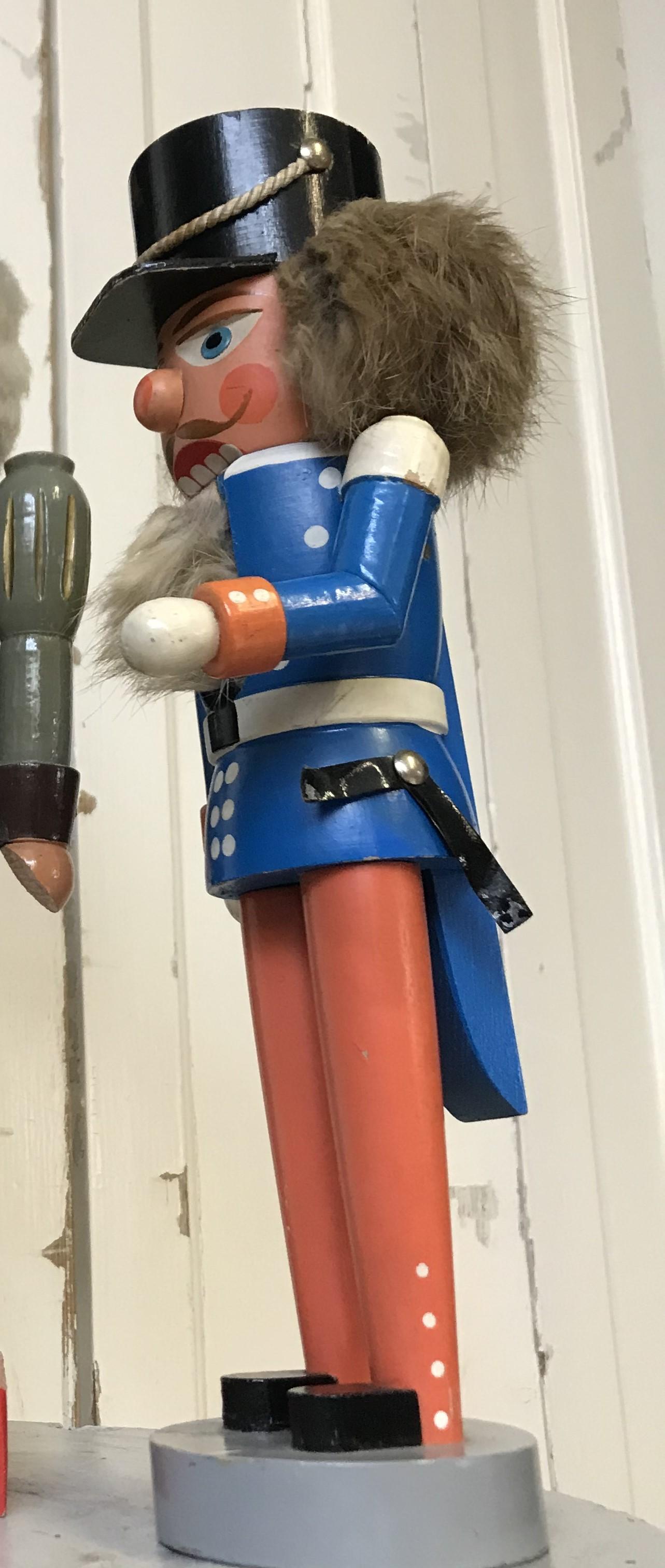 Celebrate tradition with this Nutcracker in blue and red uniform — it showcases timeless craftsmanship and charm, perfect for adding a touch of nostalgia to your décor.