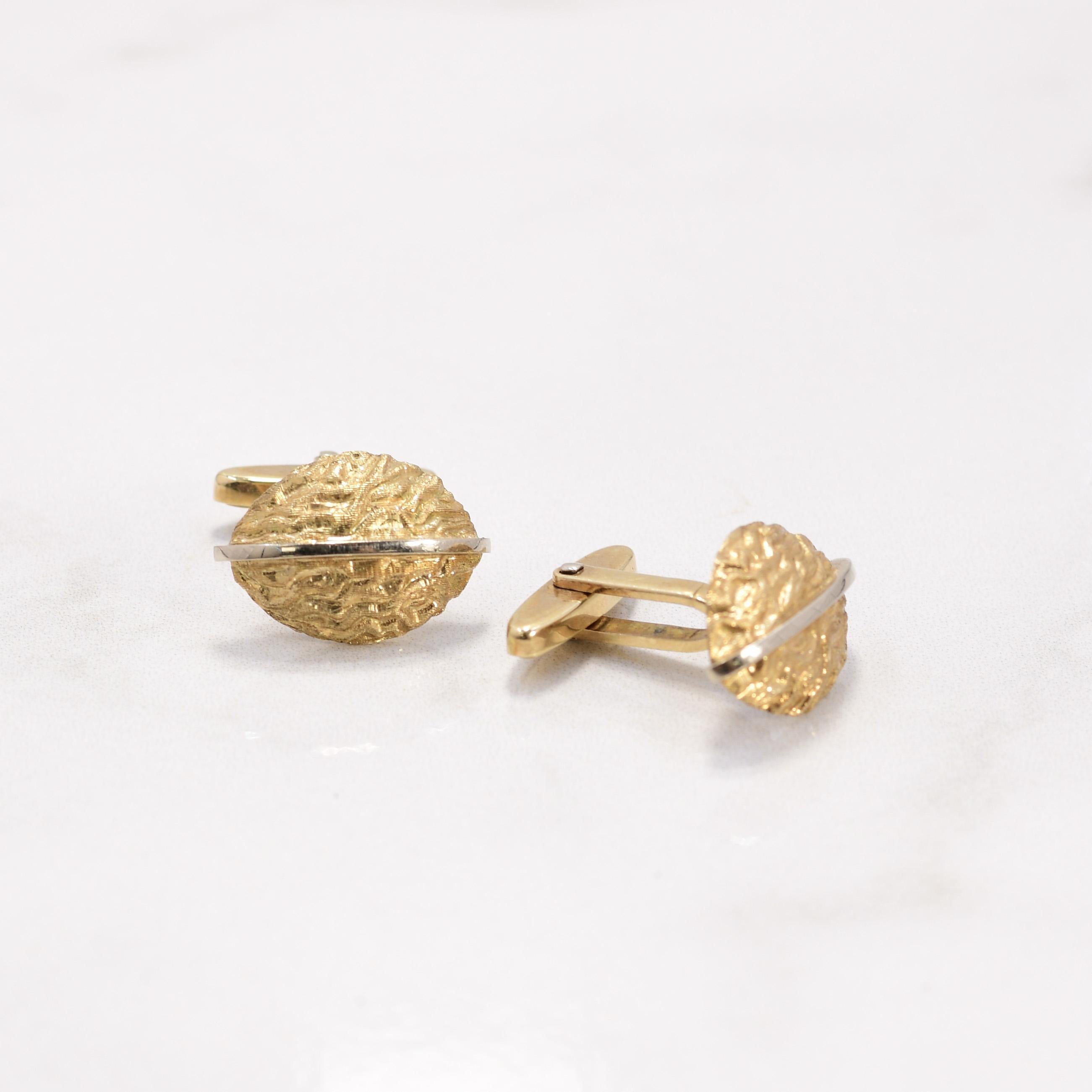 The 14K Yellow Gold Nutmeg Form Cufflinks are a unique and stylish accessory for the discerning gentleman. Crafted with exquisite attention to detail, these cufflinks feature a distinctive nutmeg shape in radiant yellow gold. Their elegant and