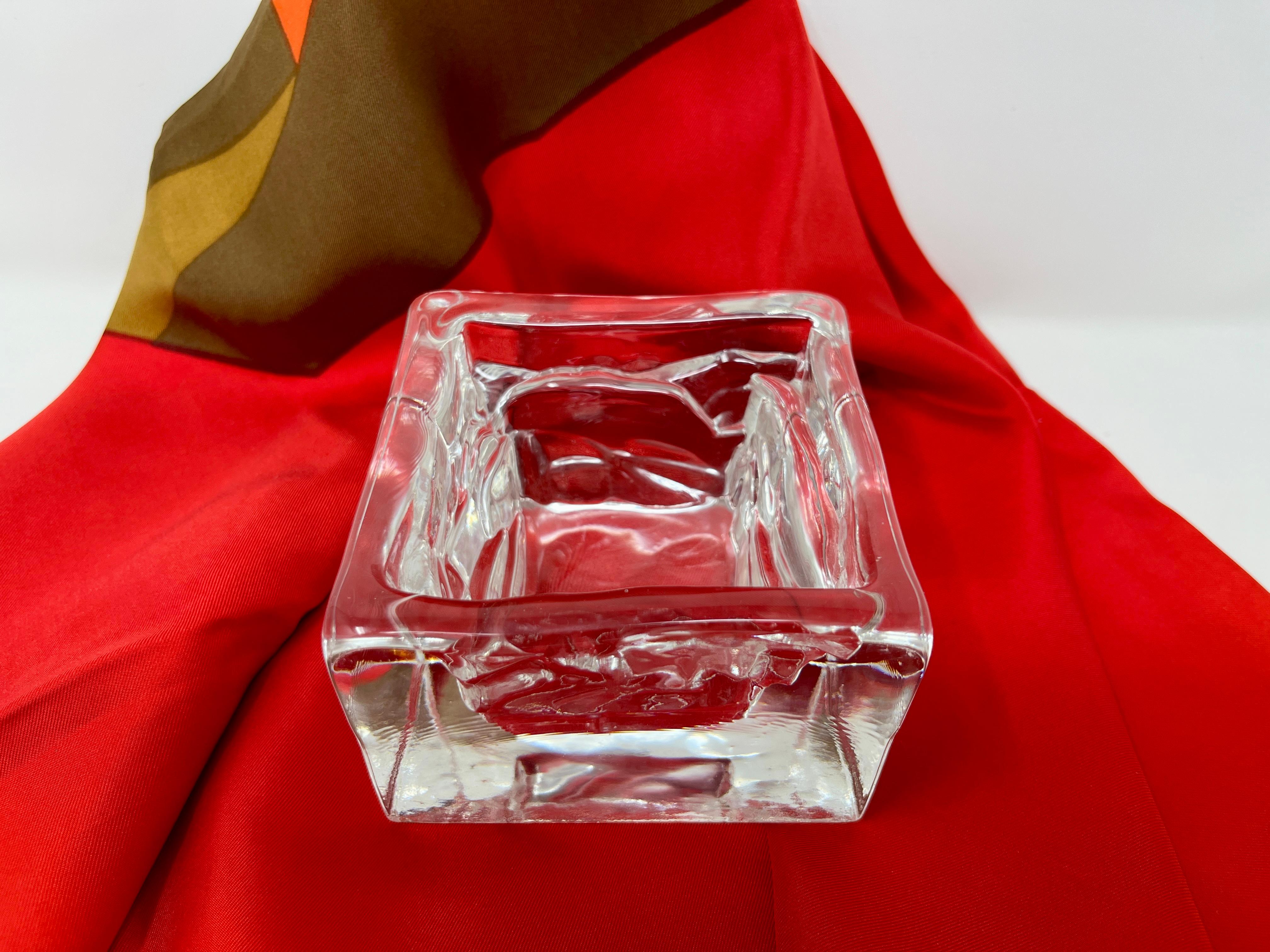 Handsome smaller clear glass square catchall. Manufactured in by Nuutajärvi Notsjõ, the oldest glass manufacturer in Finland; designed by Bjorn Weckstrom in the 1970s. From the Arktis  (or Arctic) line. Suitable as a centerpiece, catch all, candle