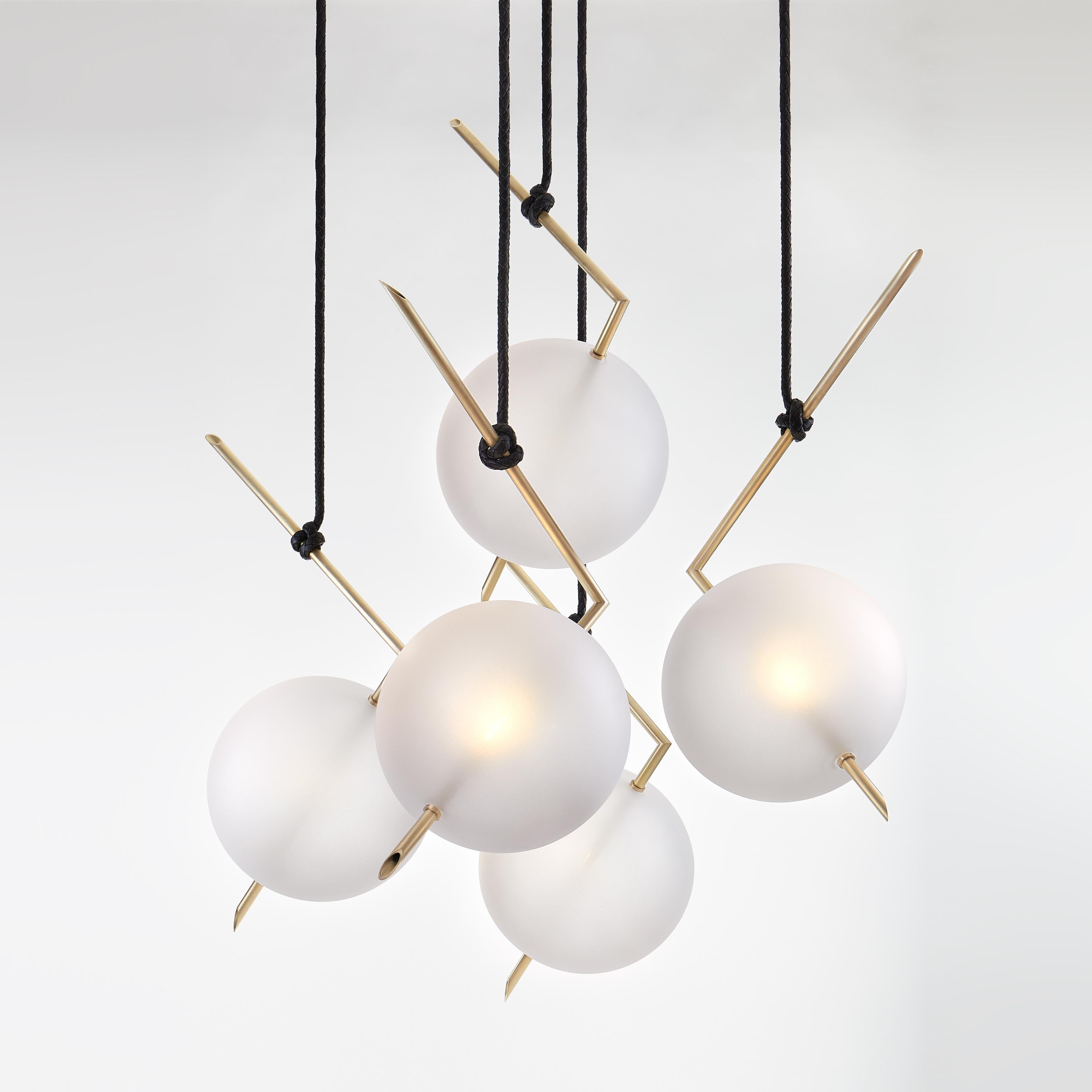 Nuvola Five Lights Chandelier - Stardust-White Pendant lamp floats in space like a bright jewel hanging from the ceiling, hooked at the end of a leather cord that has been hand-knotted around the brass tube; a perfect equilibrium of different