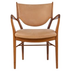 NV 46 - armchair in walnut by Finn Juhl